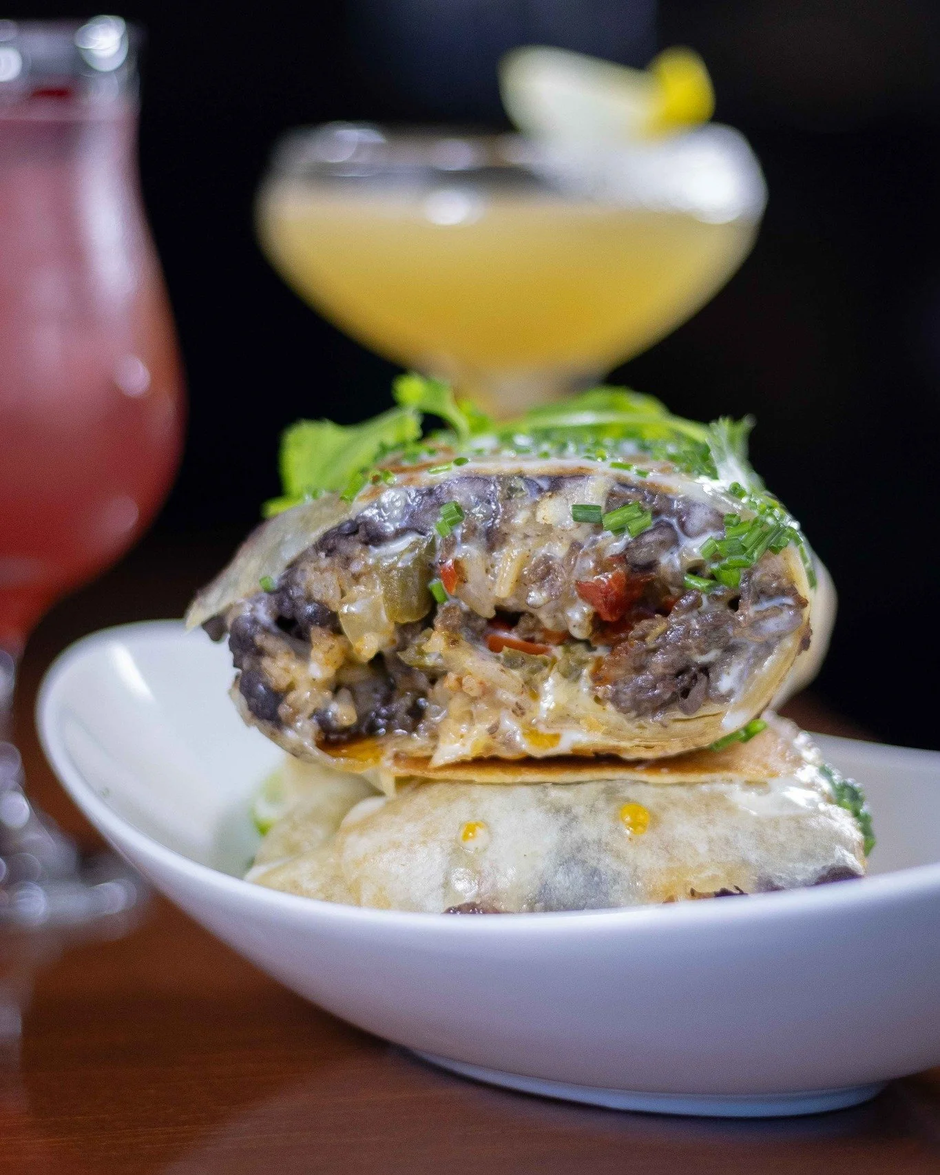 Chopped cheese... but make it a burrito 🌯 Shaved ribeye is seared with bell peppers, jalape&ntilde;o &amp; onions, rolled up in a big flour tortilla with beans &amp; rice &amp; served with crema &amp; chipotle salsa. It's real good.