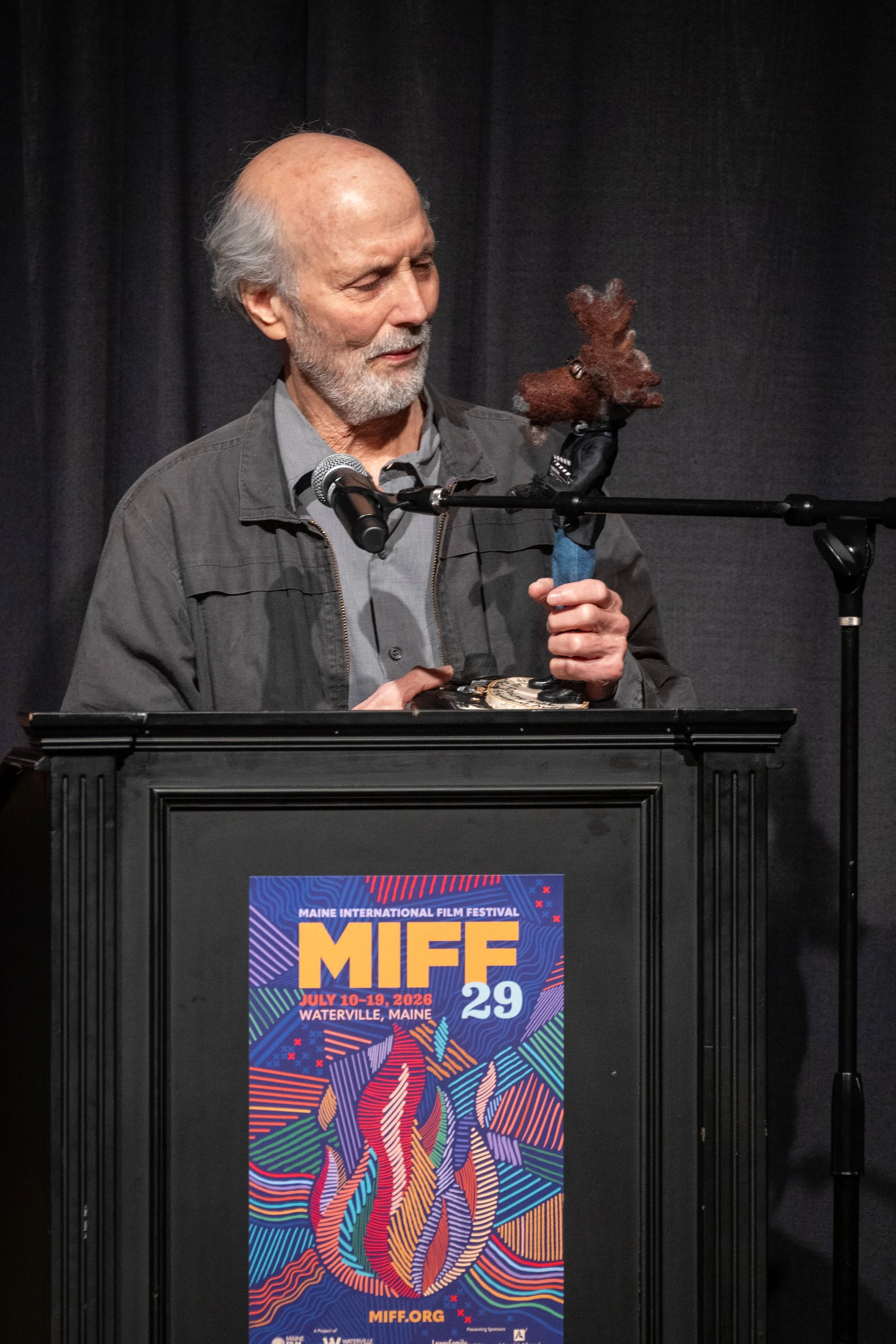 Director Alan Rudolph (Choose Me, The Moderns) examines his unique moose statuette for his MIFF Achievement Award at MIFF29.
