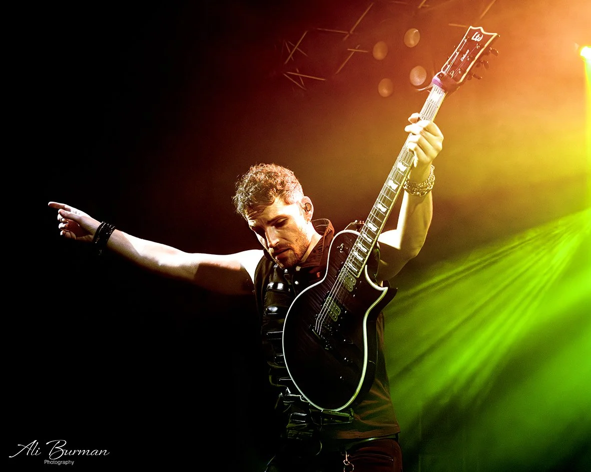 Christian Rivers performing live on stage. Professional touring guitarist, musical director and experienced guitar teacher offering online guitar lessons worldwide and in-person lessons in High Wycombe, Buckinghamshire.