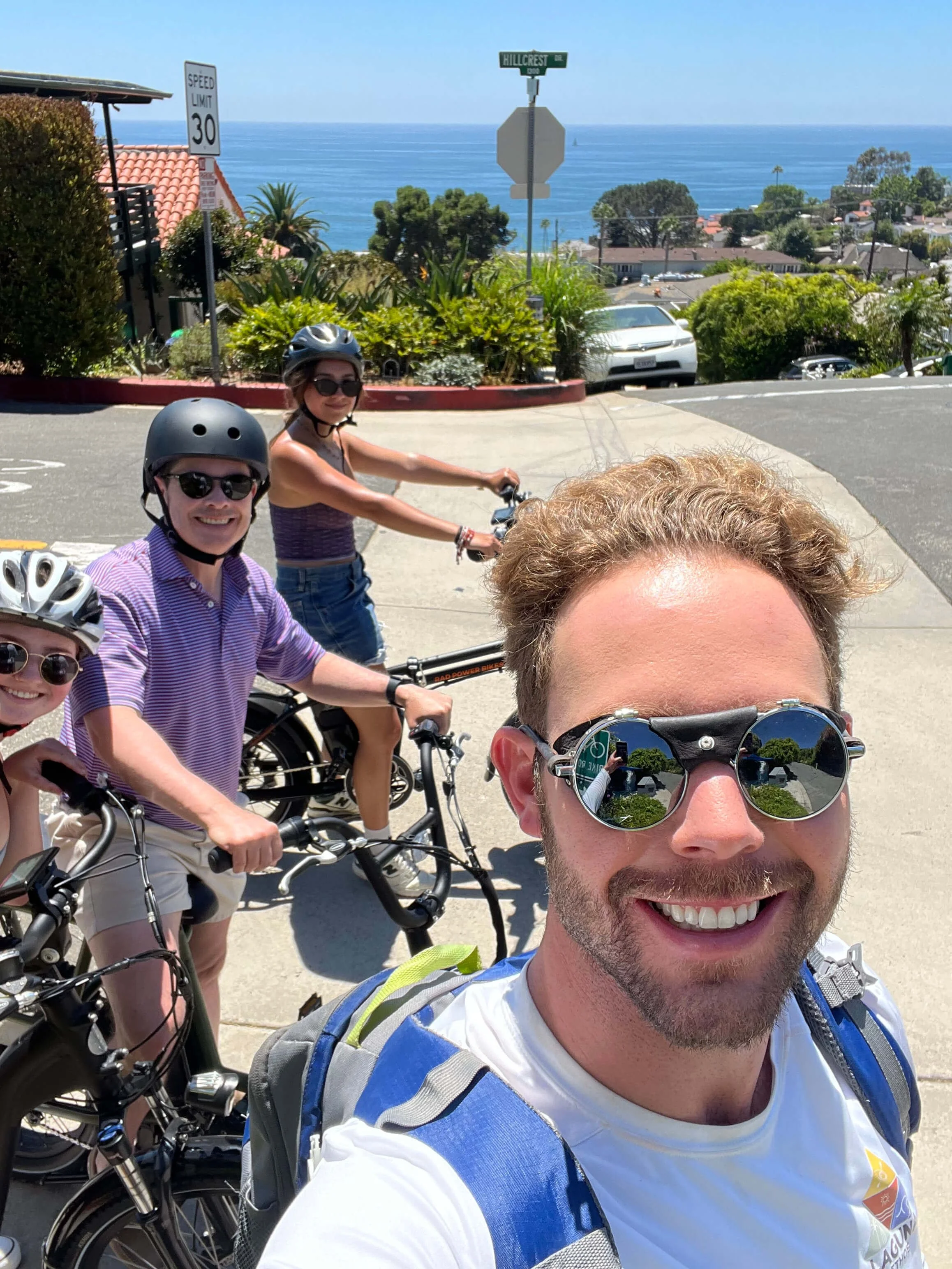 Guide and guests smiling for a photo on e-bikes.jpg