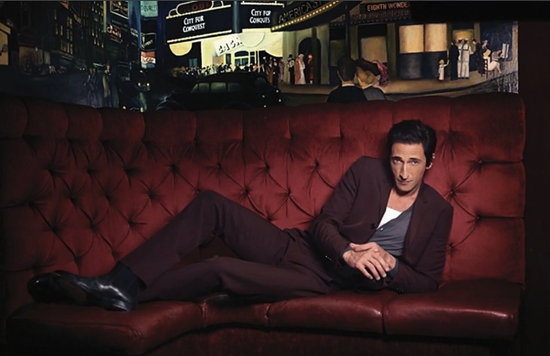 Adrien Brody on the red velvet banquette at the Triad Theater