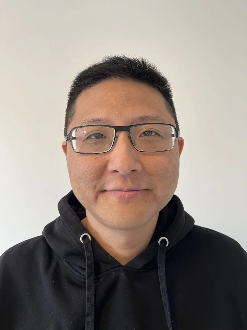 Photo of Wayne in front of a white background