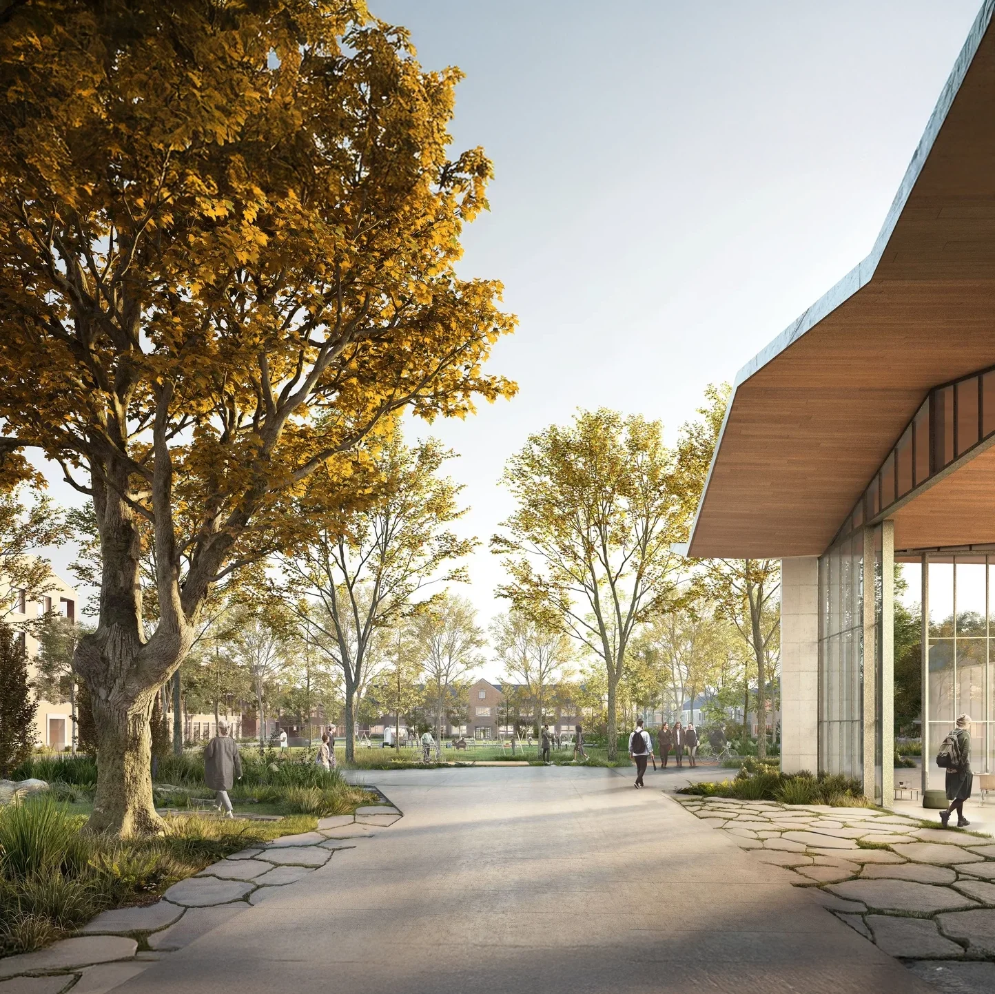 A modern public park with trees, a paved walkway, and a contemporary building with large glass windows.