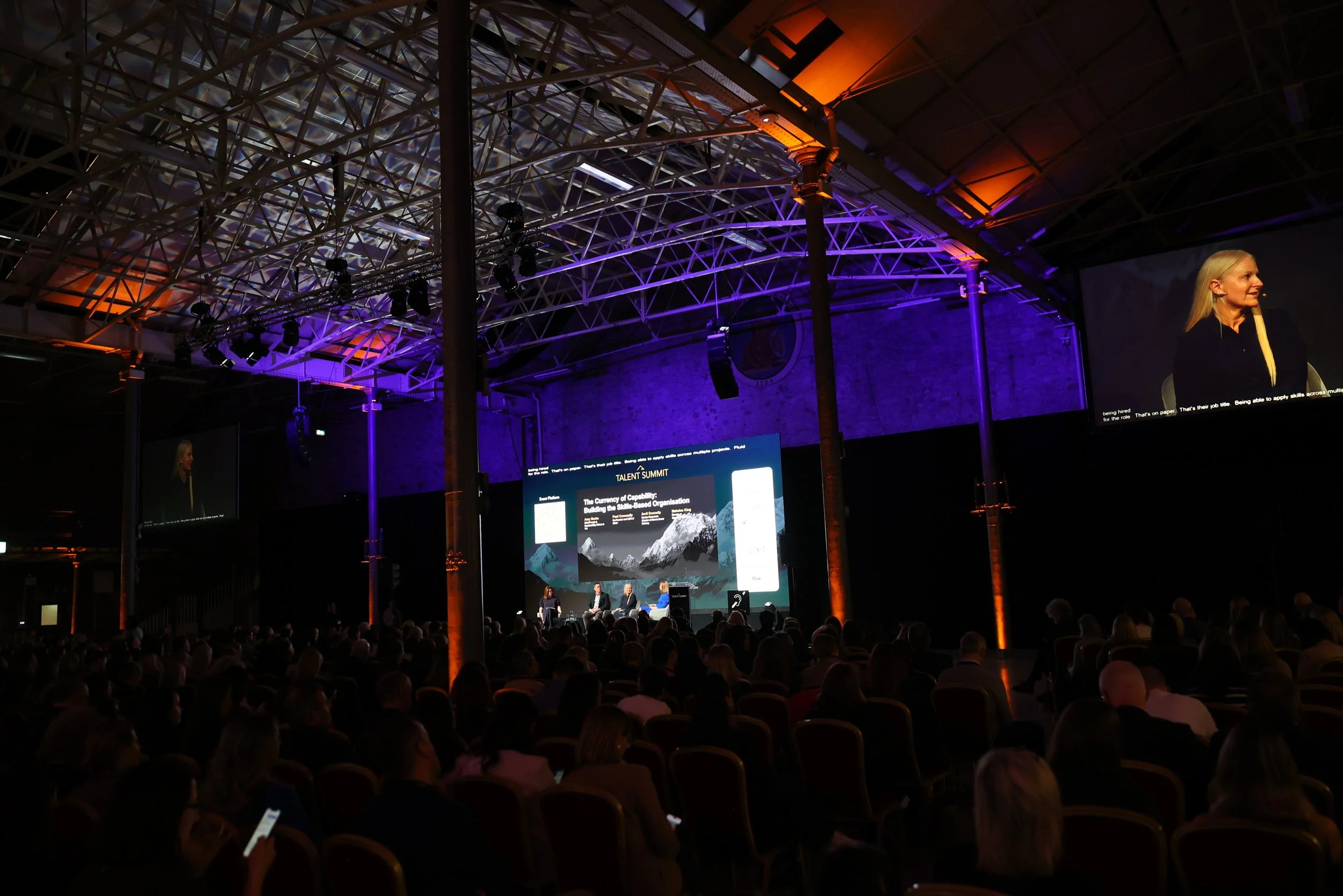 Wide photo of Talent Summit 2026 in the RDS as the stage is lit up for speakers