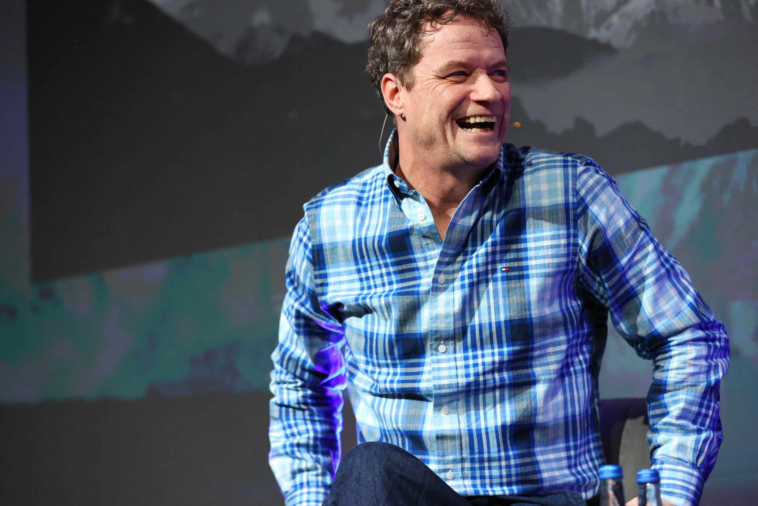 Rory O'Neill laughs during his conversation at talent summit 2026 while refelcting on how his lived experience has shaped his worldview