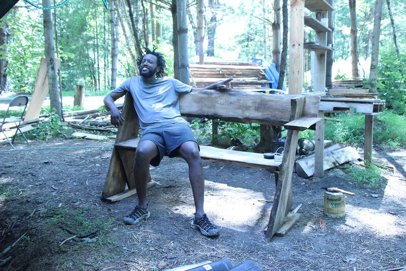  Nixon modeling the Aldo Leopold bench we build during the week using maple harvested from the land 