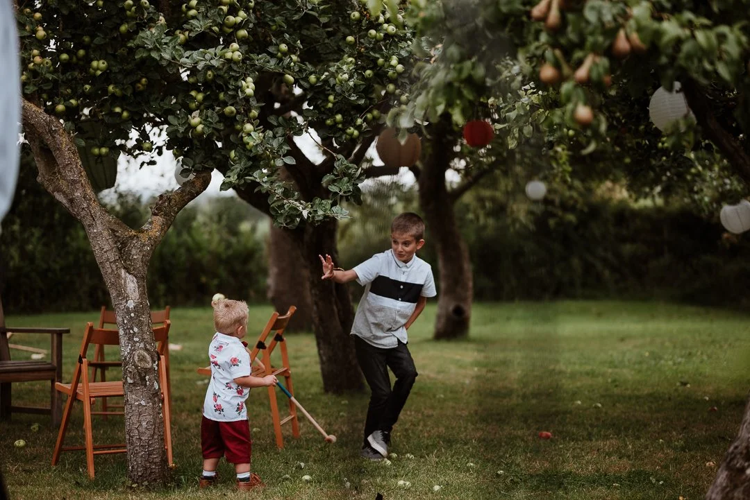 children playing lawn games at the orchard garden in dairyhouse farm