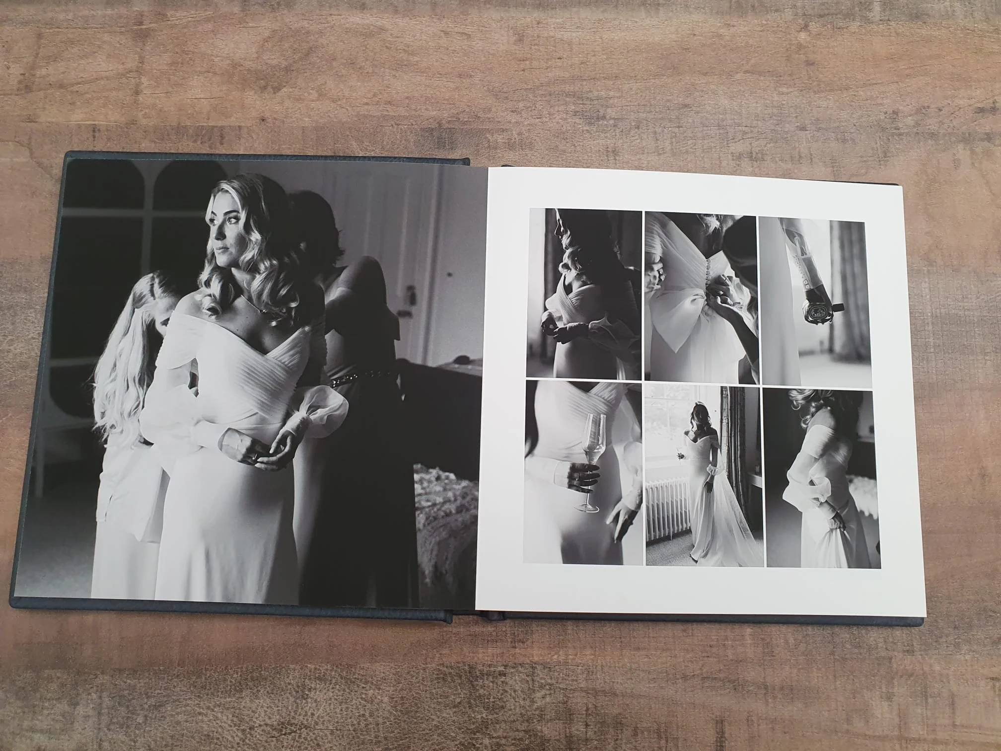  fine art wedding album displayed on a wooden table 