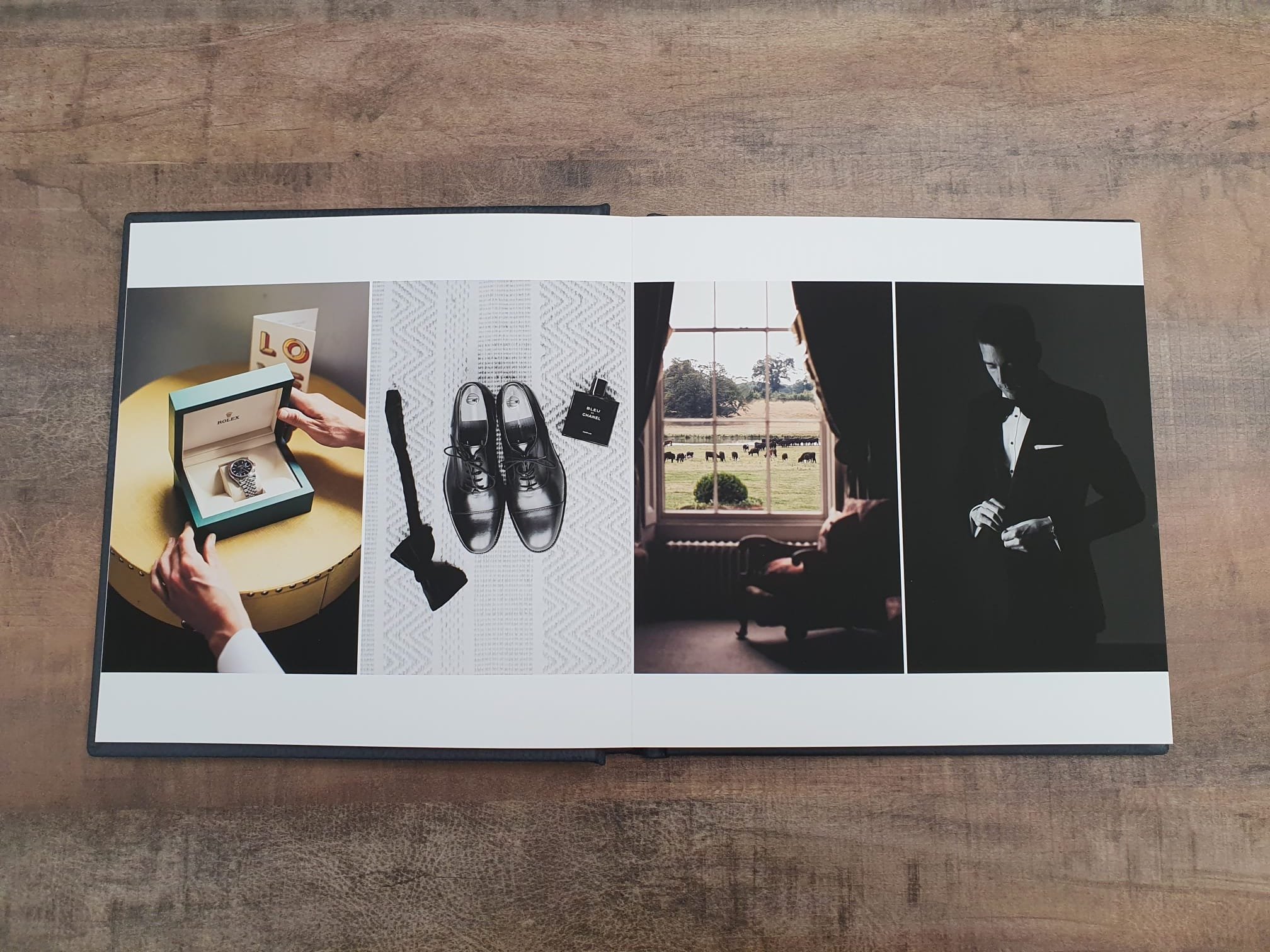  fine art wedding album displayed on a wooden table 