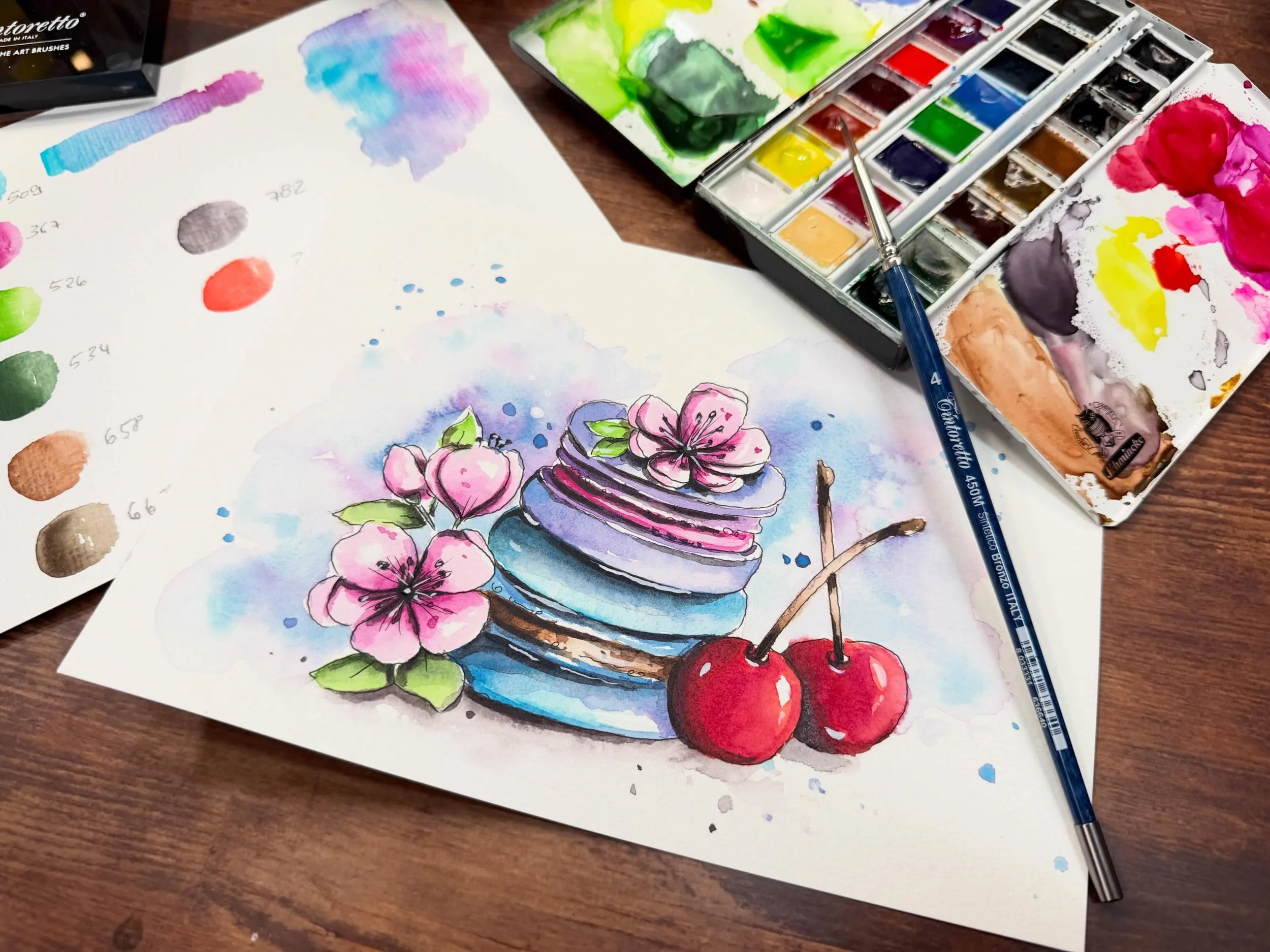 Hallo zusammen 🌸🍒🌸
Eine neue Video-Anleitung wartet auf dich, auf die ich mich schon riesig gefreut habe: Wir malen gemeinsam diese wundersch&ouml;nen Macarons mit Kirschen und Kirschbl&uuml;ten.

Das Besondere an diesem Motiv ist die ganz gezielt