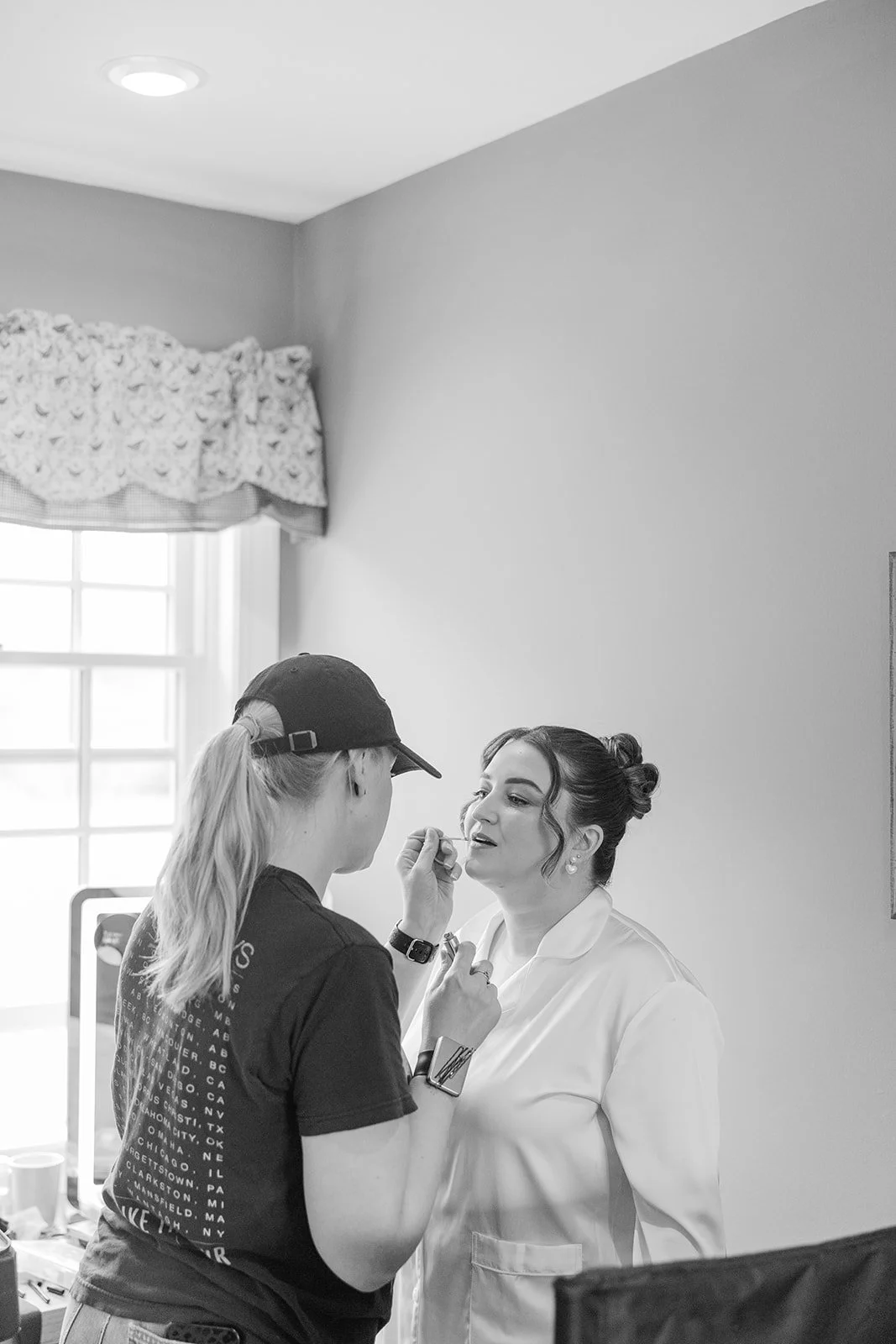 Bride gets her hair and makeup done in the Loft at Cold Spring Farm.
