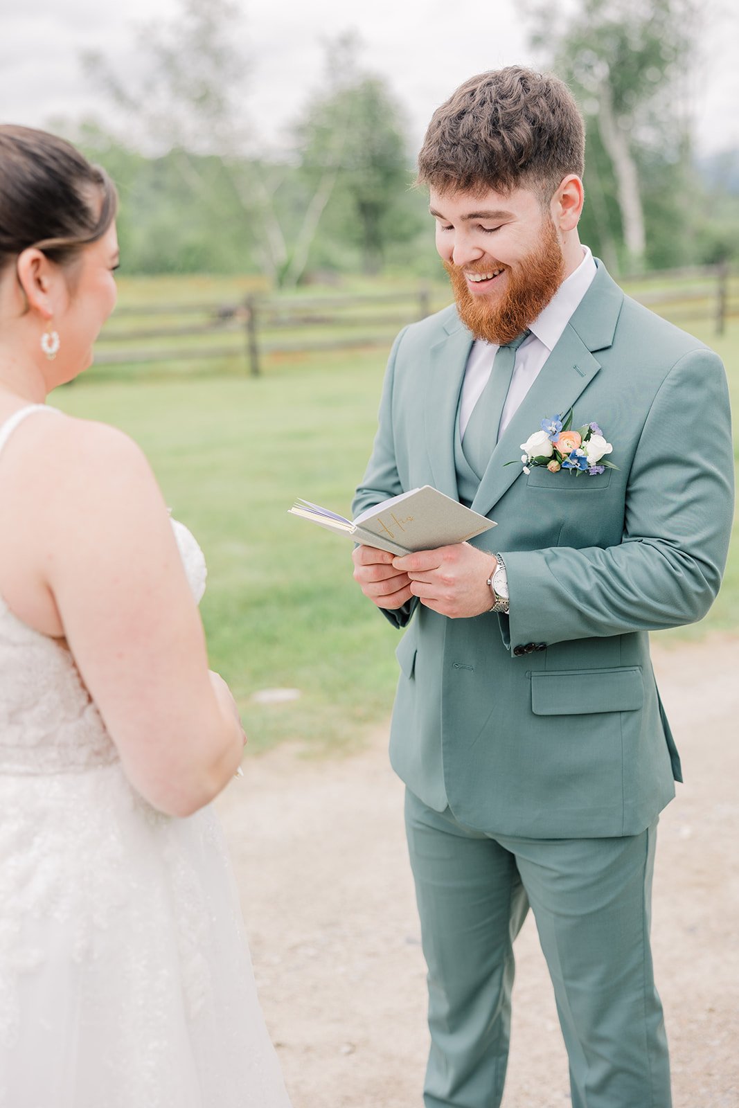 Bride and Groom share a private moment to exchange their vows before the ceremony at their garden wedding.