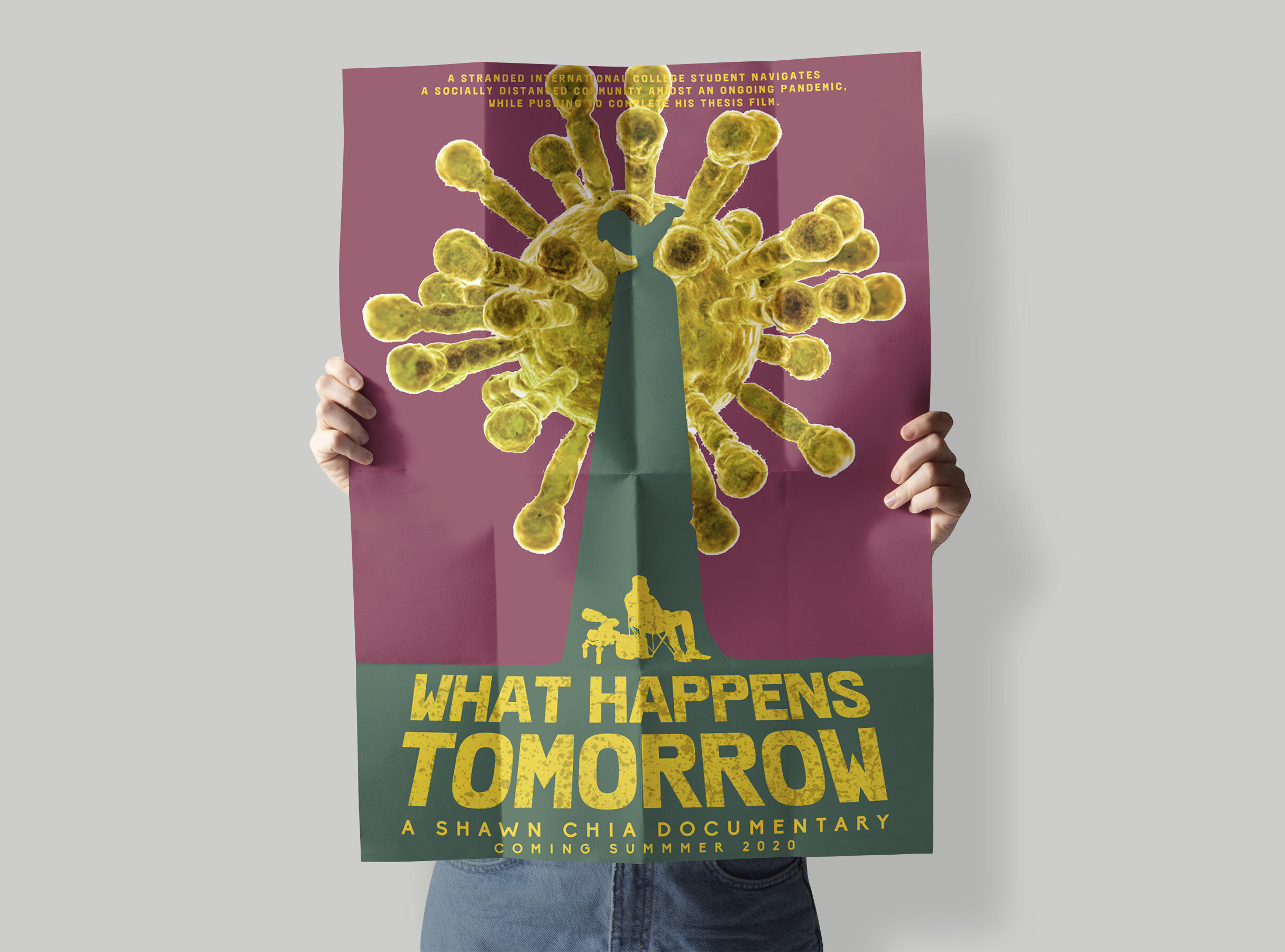 Hands hold up a vibrant film poster.