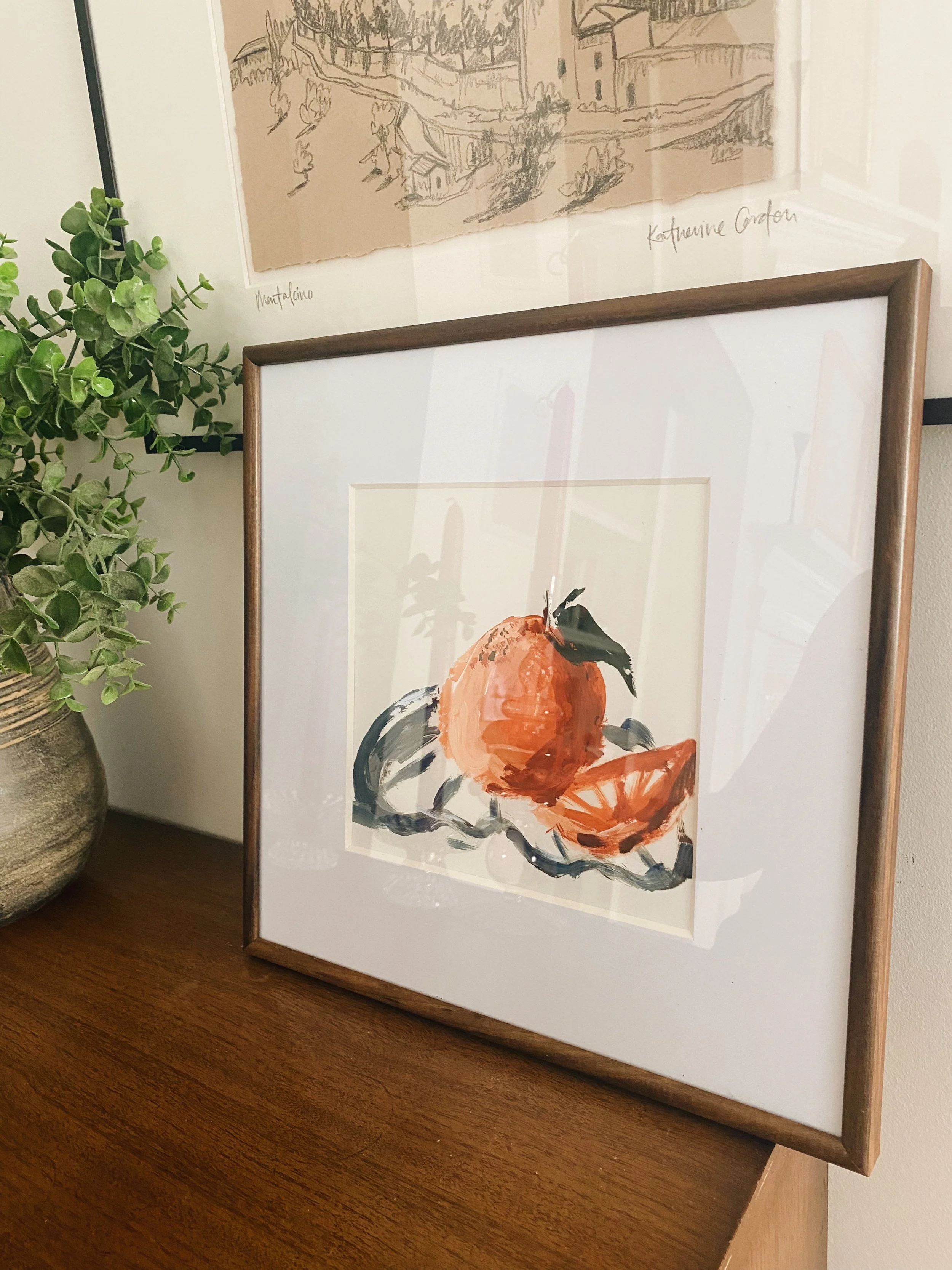 framed premium reproduction print of an orange on plate painted in acrylics