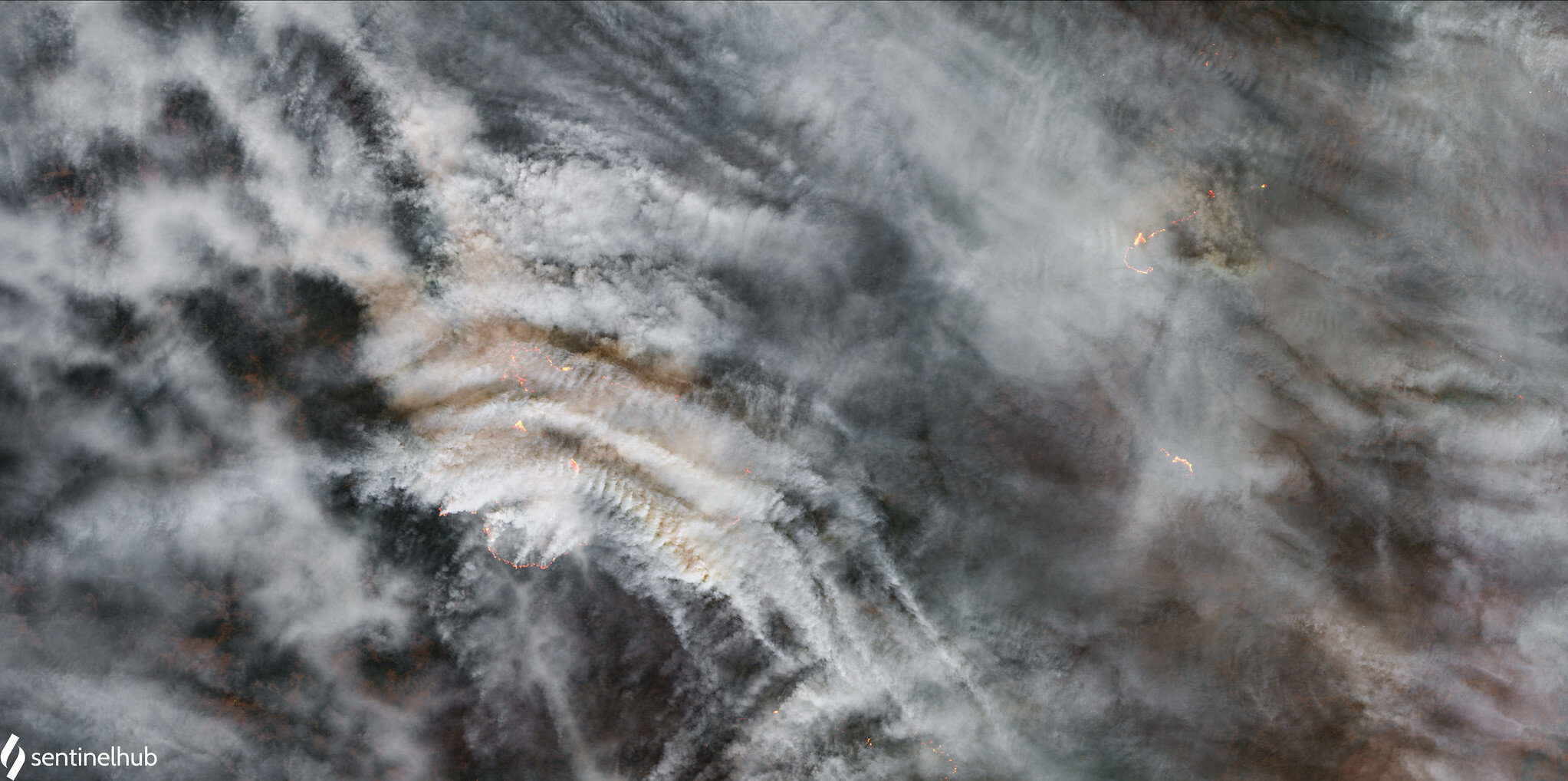 Satellite image of forest fire smoke and flames