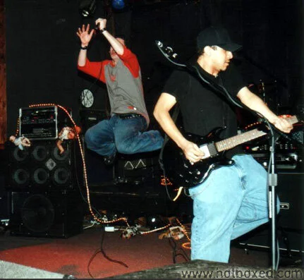 Ryan Mann (airborne) and Joseph Aguirre on guitar.