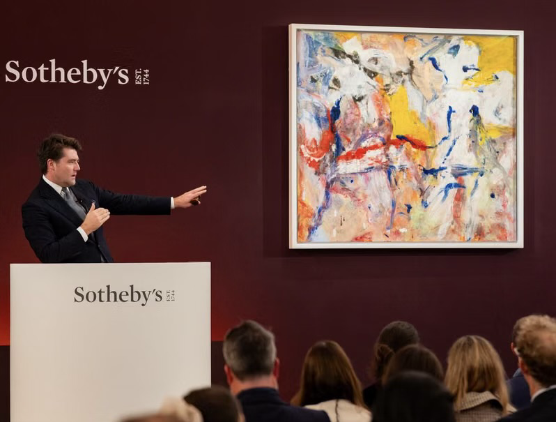 Auctioneer conducting a live contemporary art auction at Sotheby’s
