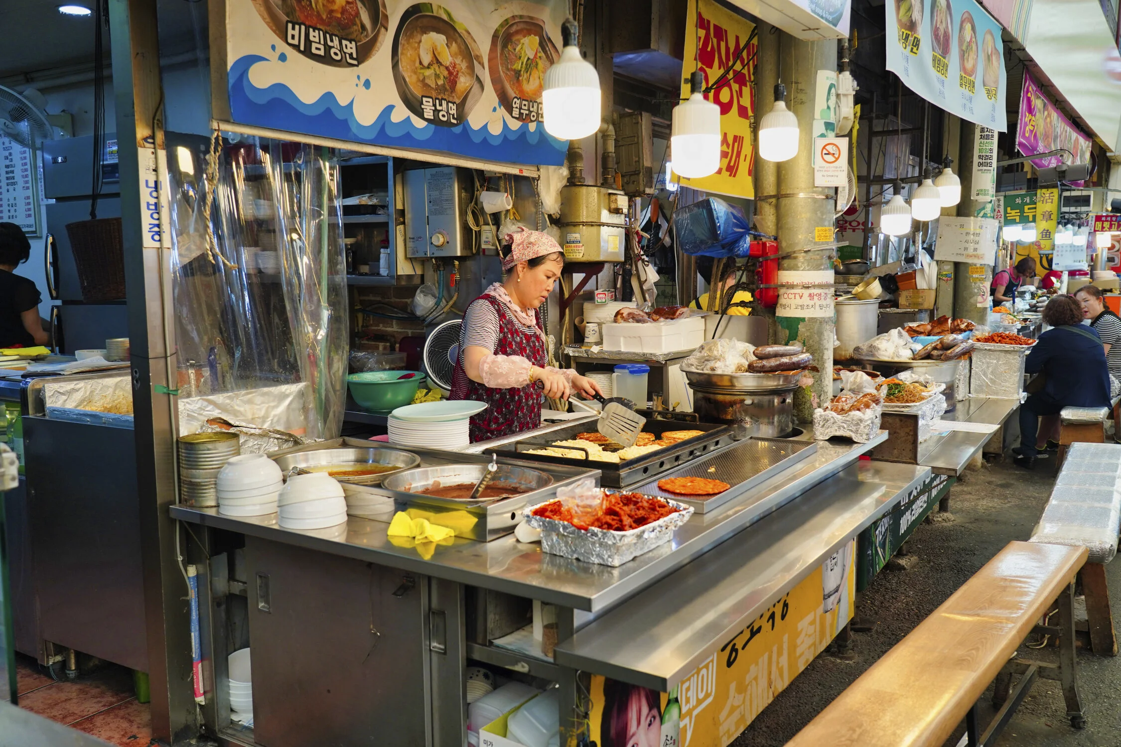 Woman making mung bean pancakes