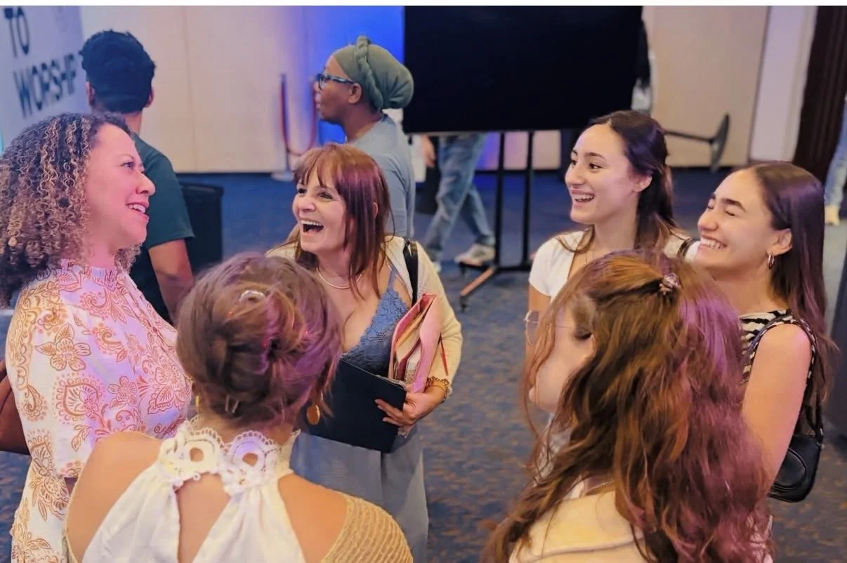 Harvest church members smiling and talking together