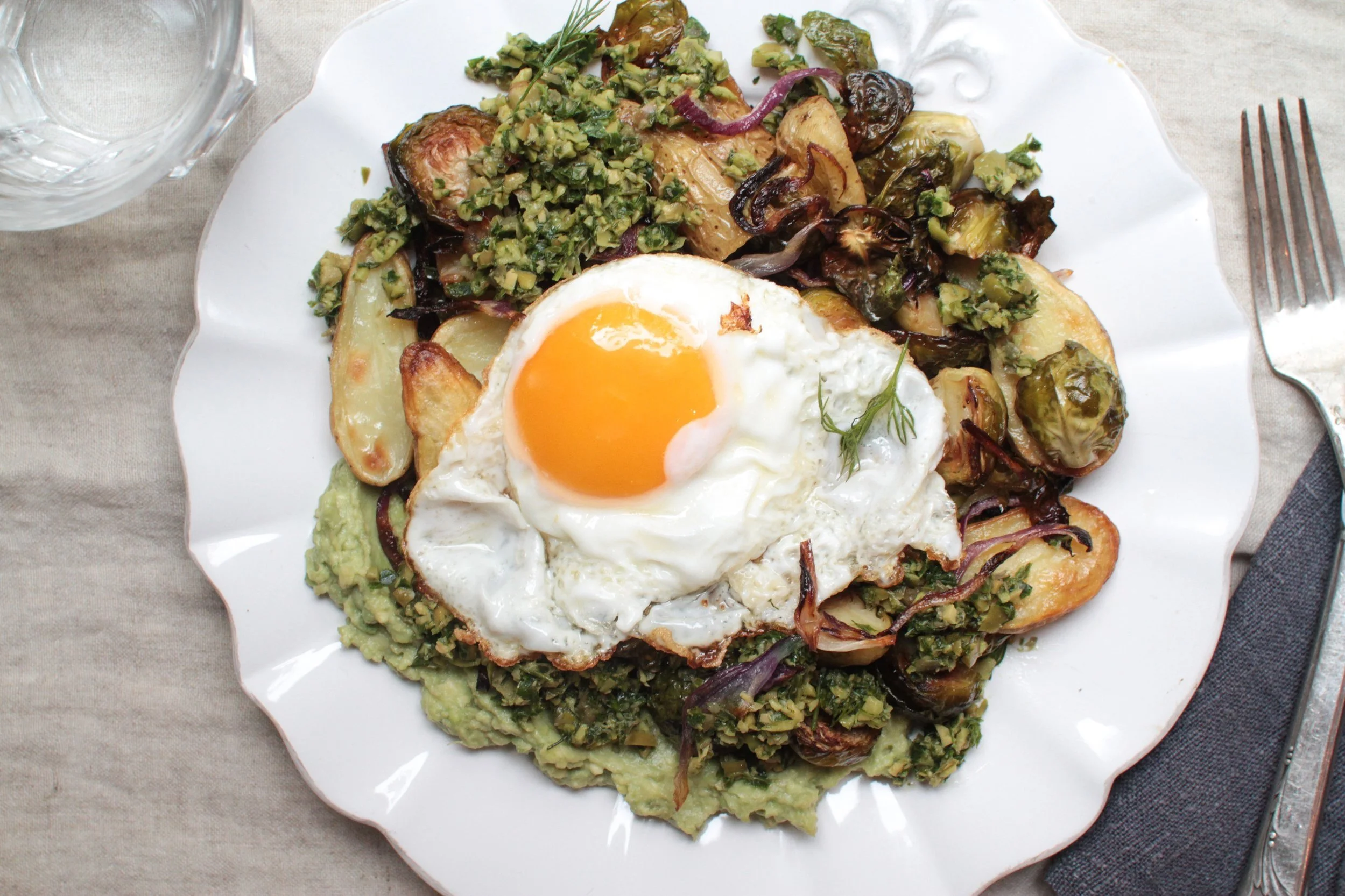 roasted potatoes and brussel sprouts with smashed avocado, olive-caper gremolata, and a sunny egg      c/o "maman: the cookbook" (gf + df)