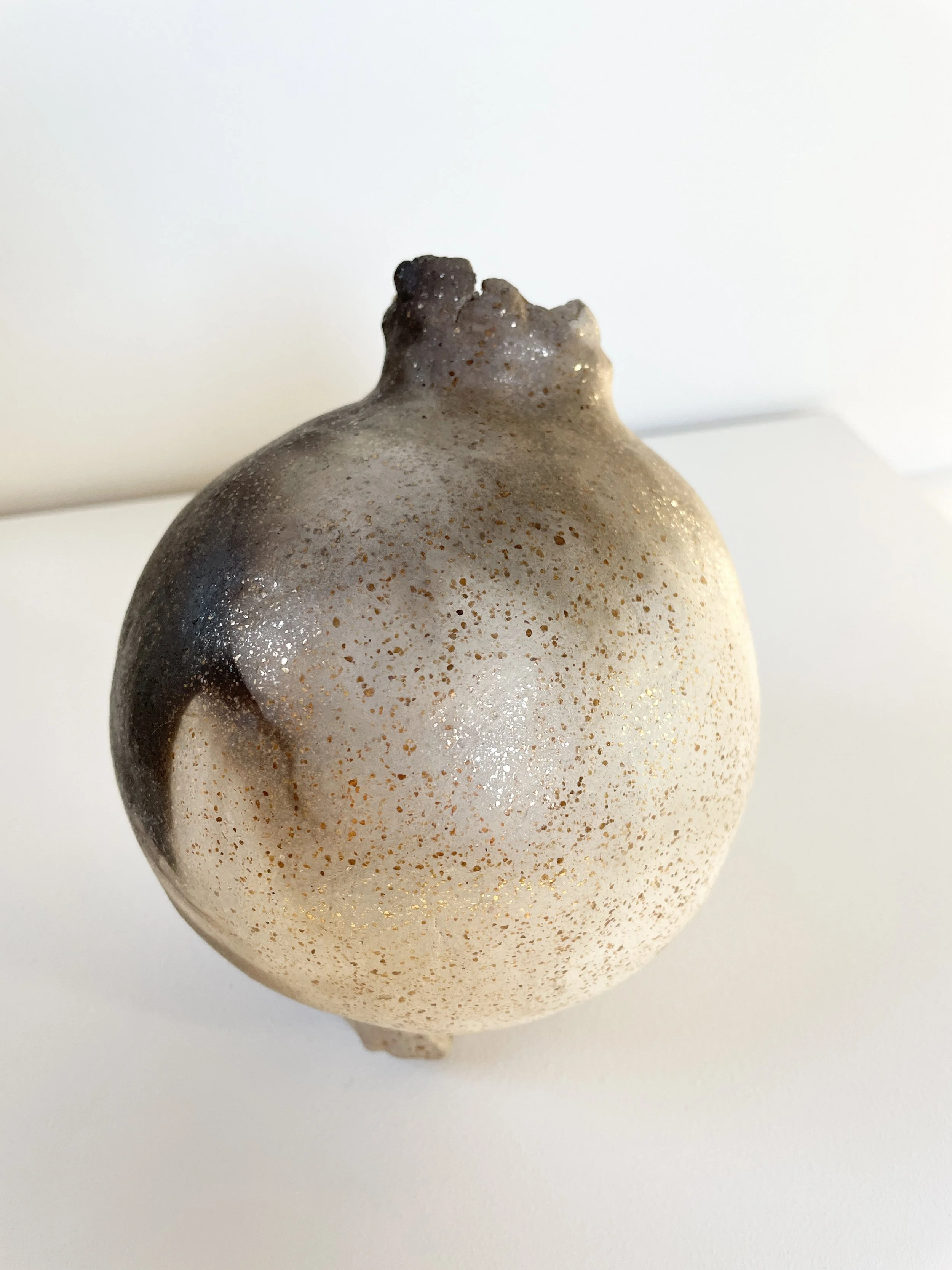primitive pomegranate (white), 2026, New Mexican white micaceous clay, fire, 7 x 5 x 5 inches