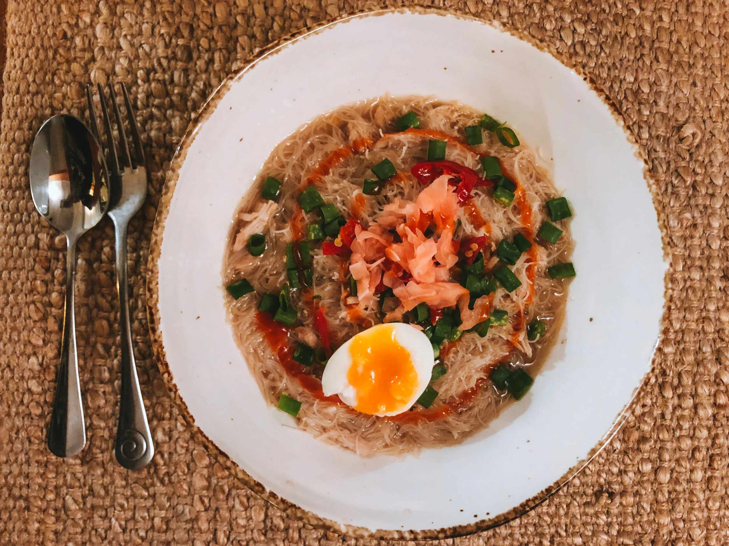 Broth infused Chicken Vietnamese Pho topped with Ginger, Spring Onion &amp; Organic Sriracha sauce.