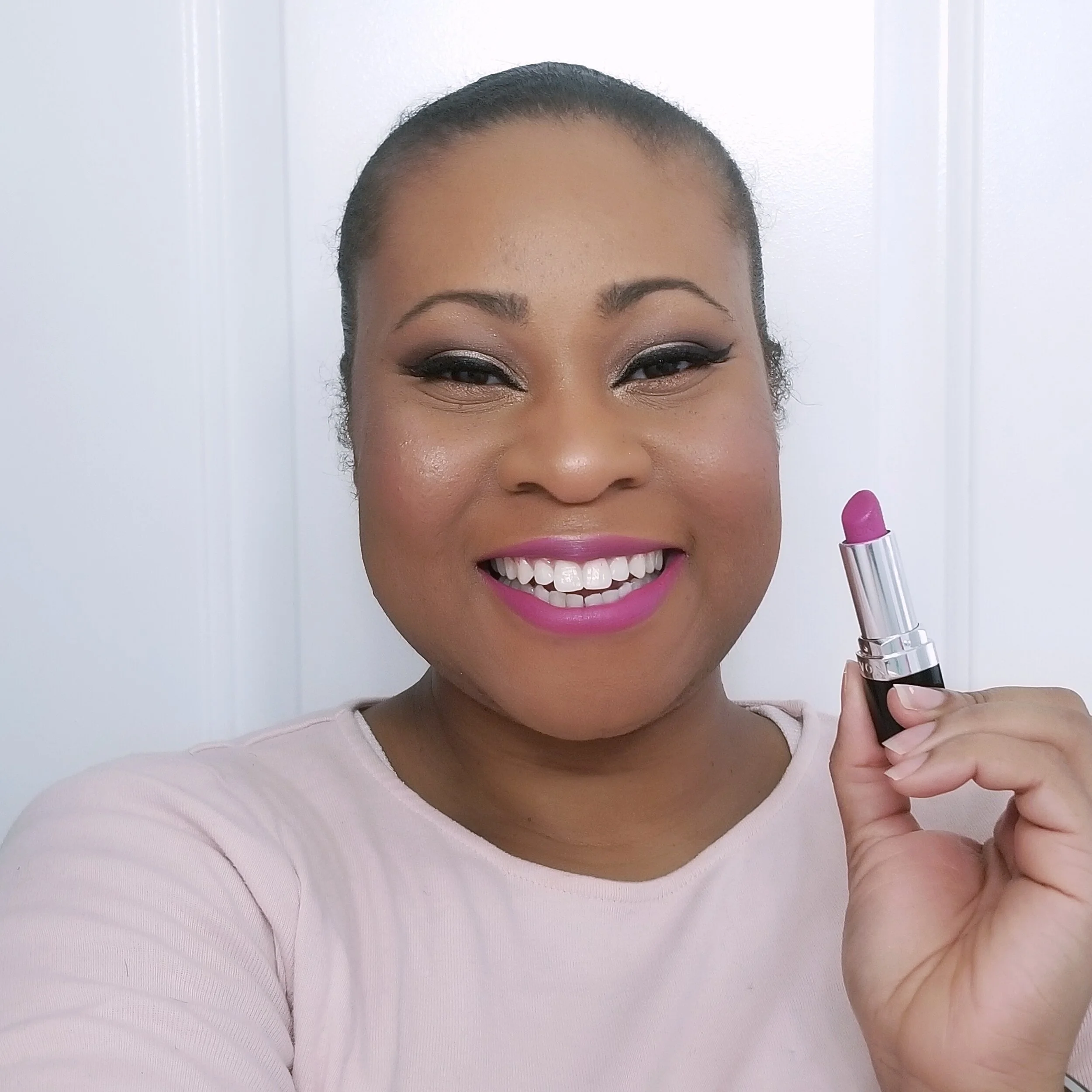 Avon lipstick Georgiana woman of color with pink lipstick