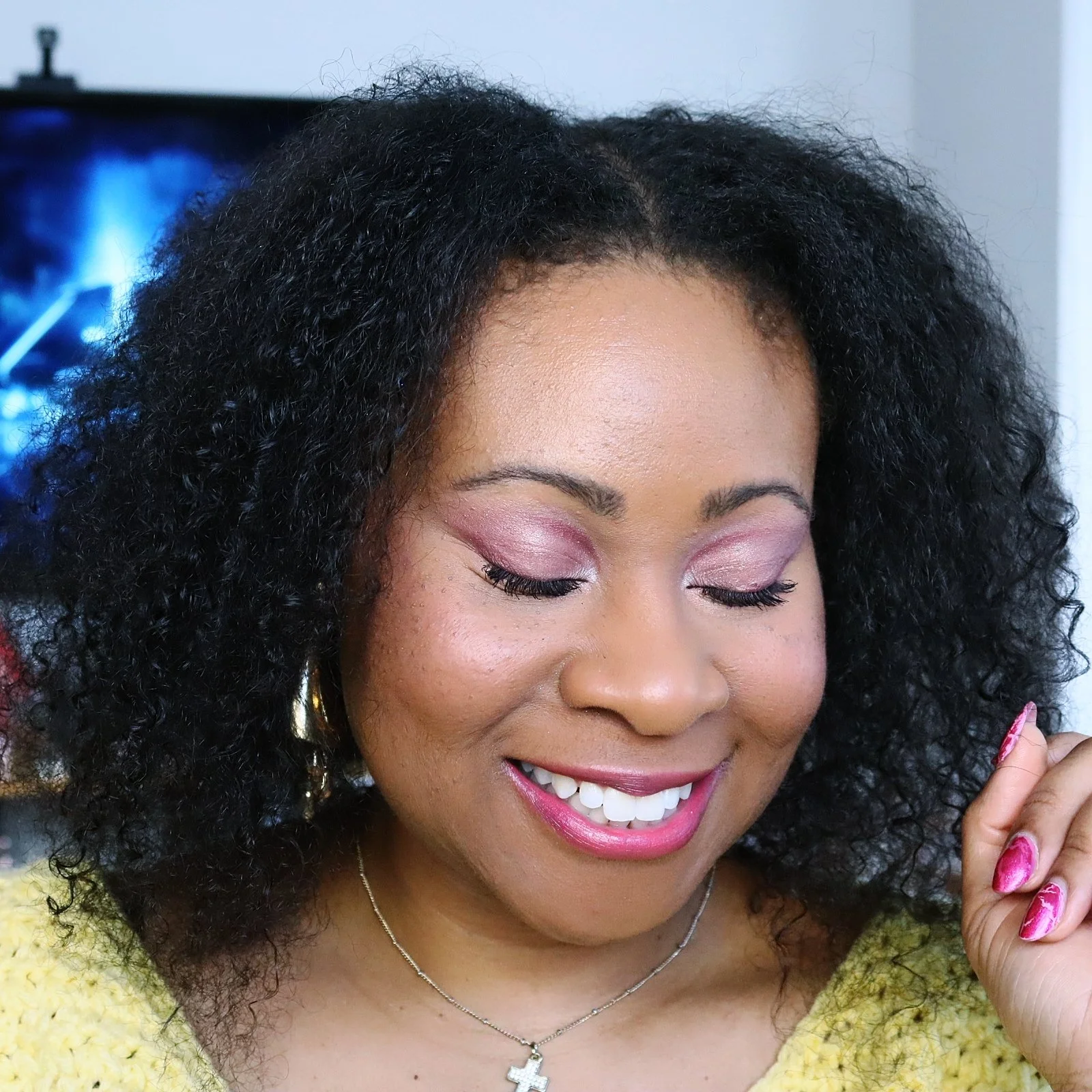 balck woman with natural hair and red makeup
