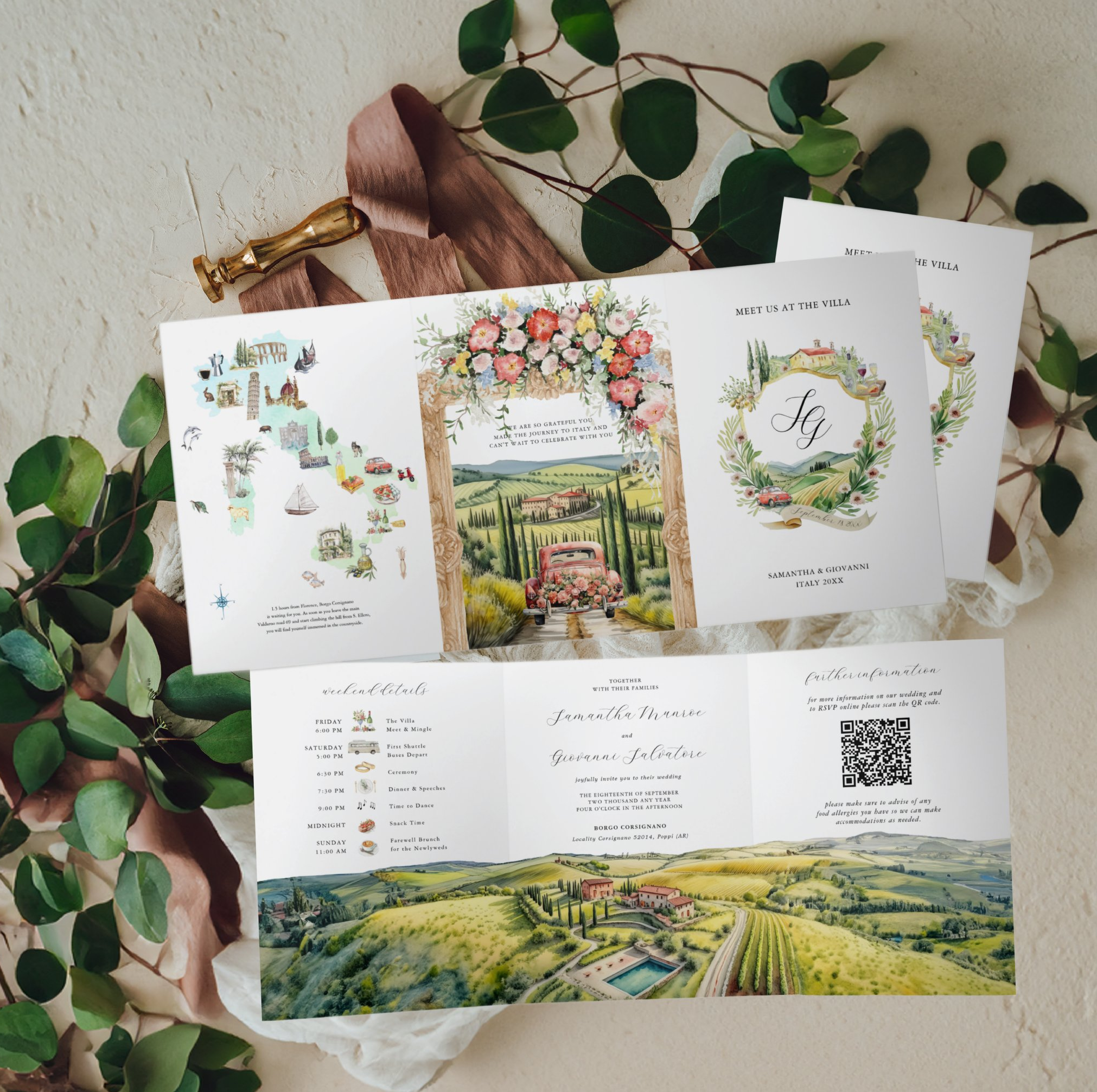 Flat lay of a custom Tuscany, Italy destination wedding invitation suite featuring a hand-painted trifold invitation, illustrated regional map, vineyard landscape artwork, custom monogram cover, and matching stationery. The watercolor illustrations c