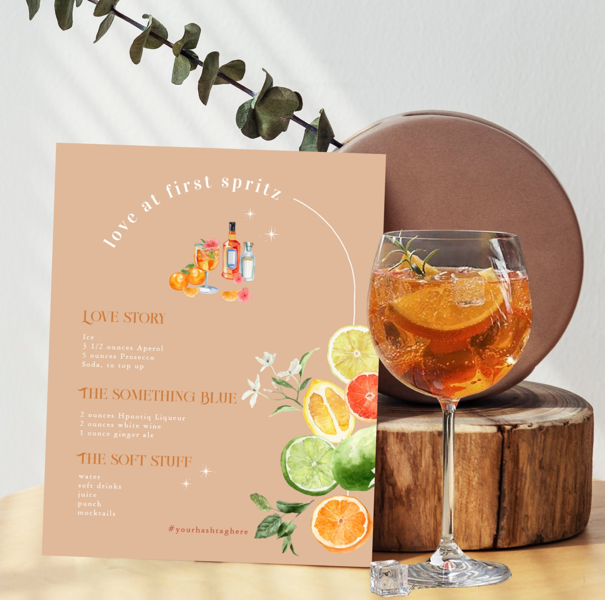 Illustrated wedding signature drinks sign featuring watercolor cocktail illustrations, citrus accents and a modern "Love at First Spritz" cocktail menu for a wedding bar.