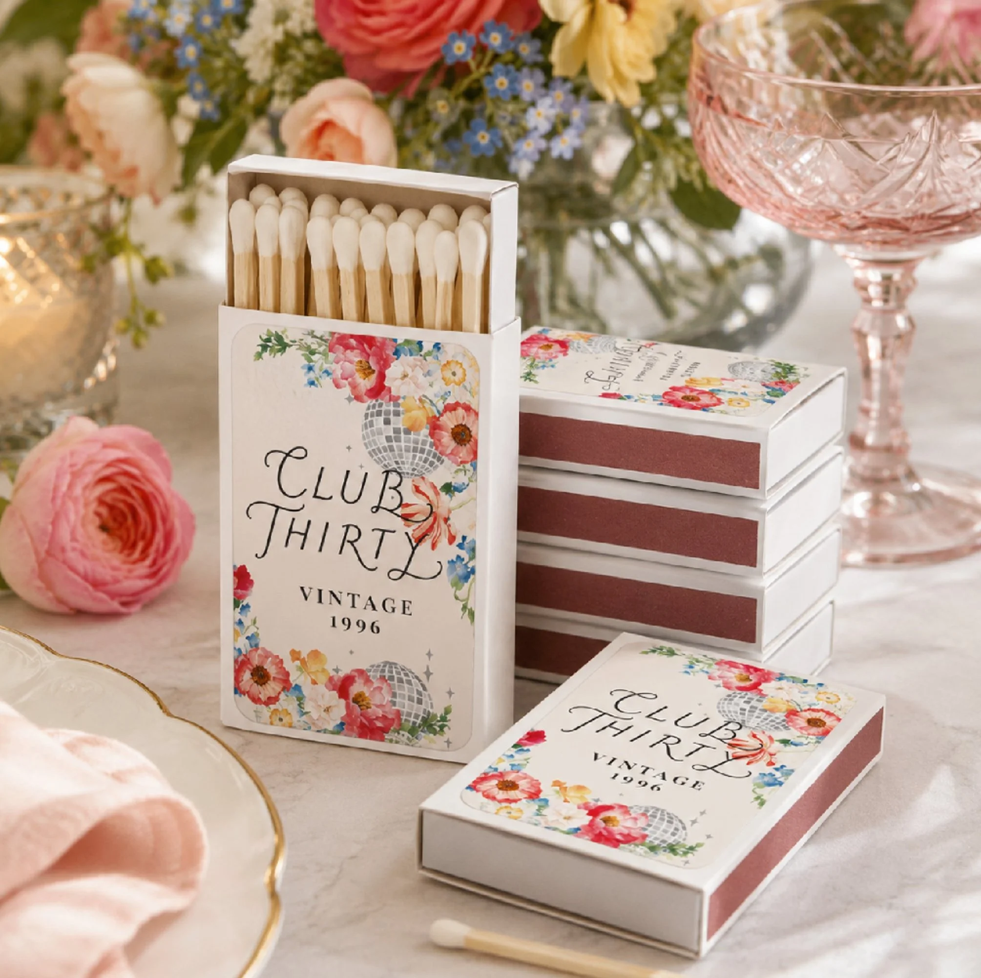 Custom Garden Disco matchbox favors featuring signature lettering, watercolor florals, disco balls, and personalized typography for weddings, birthdays, and special events.
