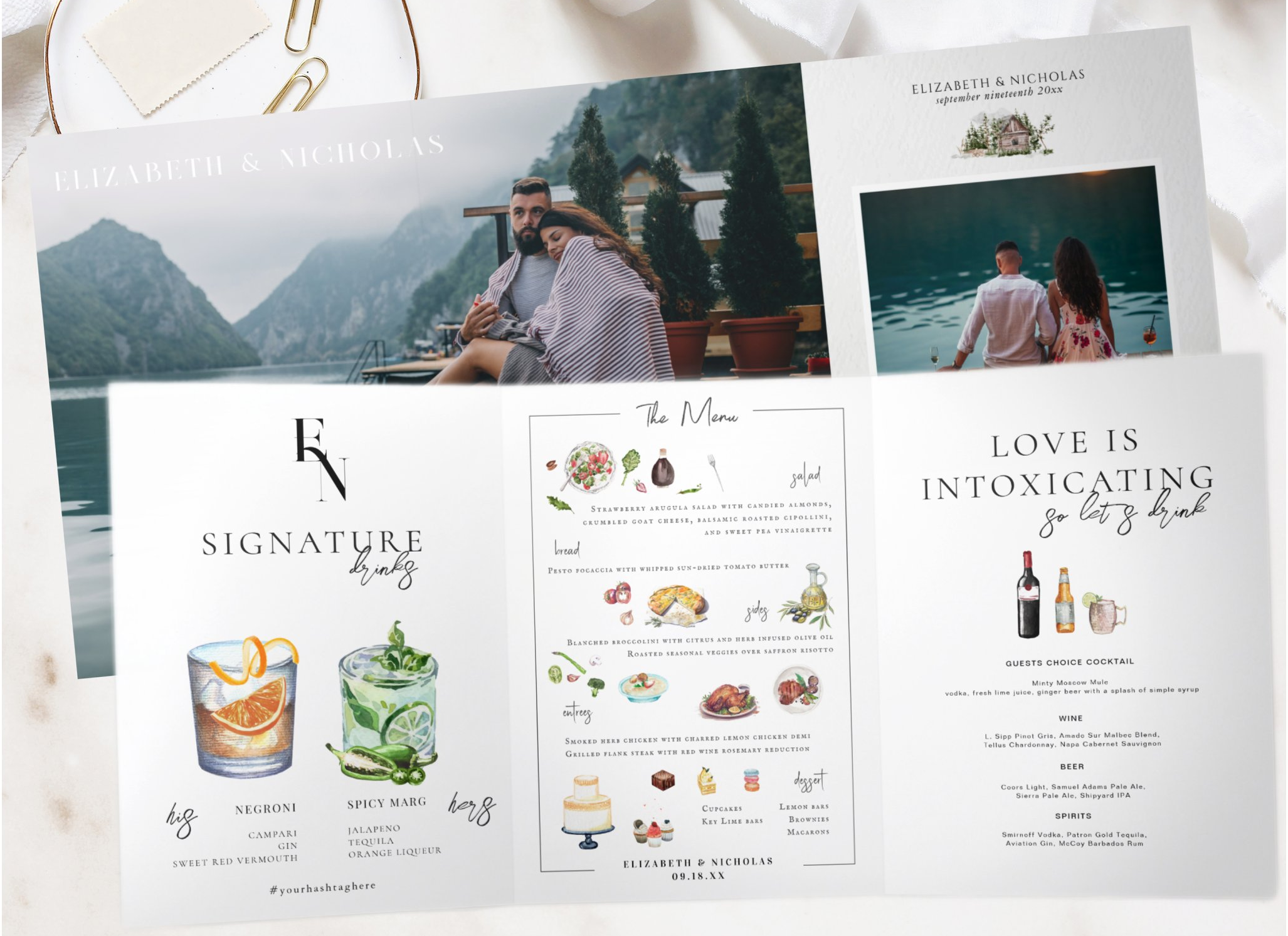 Flat lay of a custom wedding stationery suite featuring a photo table number card, illustrated wedding menu, and matching signature cocktails sign. The coordinated reception stationery combines romantic engagement photography with hand-painted waterc