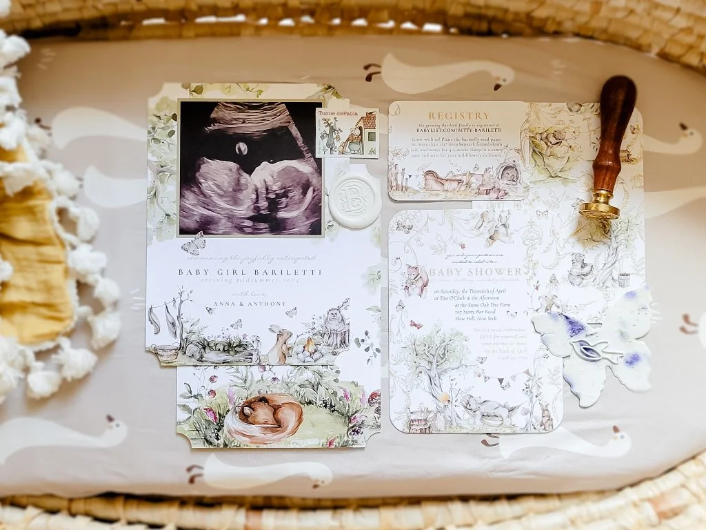Custom illustrated woodland baby shower stationery suite featuring personalized invitation, registry card, ultrasound keepsake, coordinating inserts, thank-you notes, and watercolor woodland artwork.