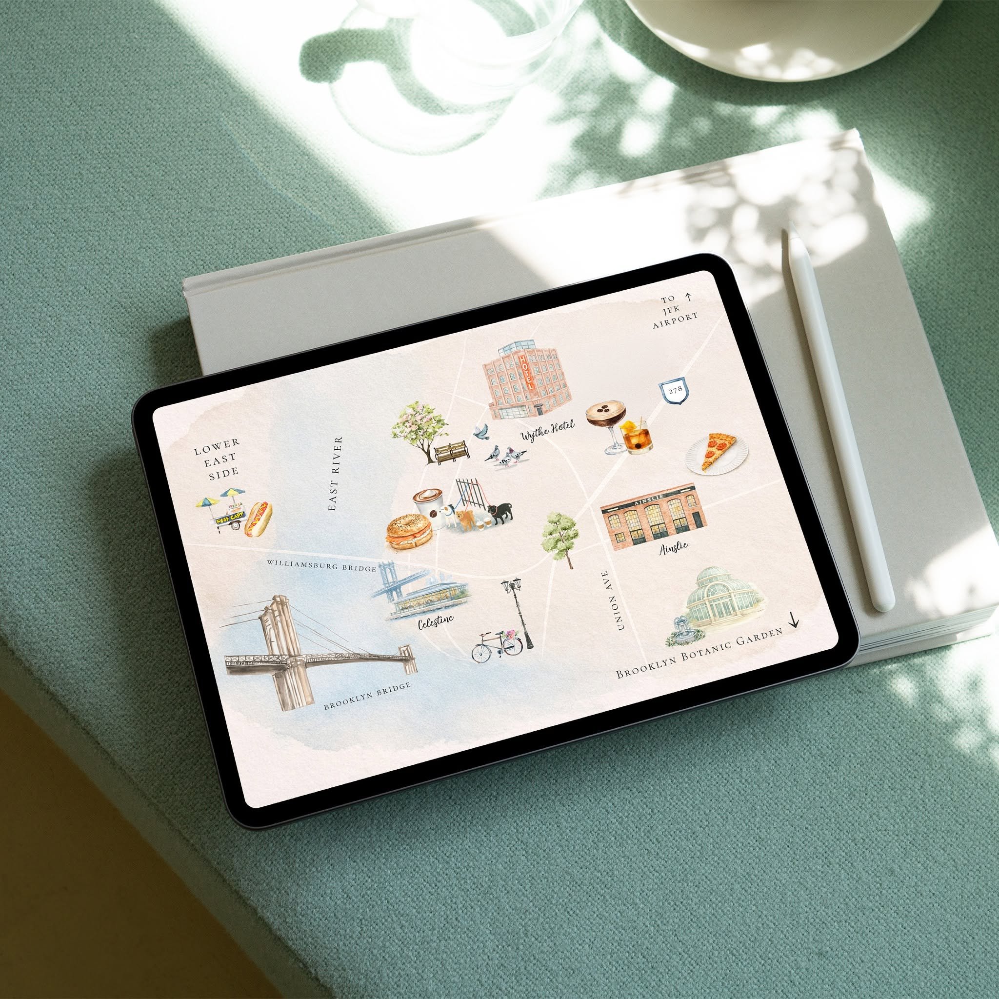 Tablet displaying a custom illustrated Brooklyn wedding weekend map with hand-painted landmarks, venue illustrations, and local recommendations for guests.
