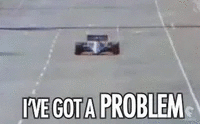 Une voiture de course sur un circuit avec le texte 'J'ai un problème' en dessous.