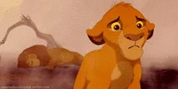 Un lionceau triste dans la savane.