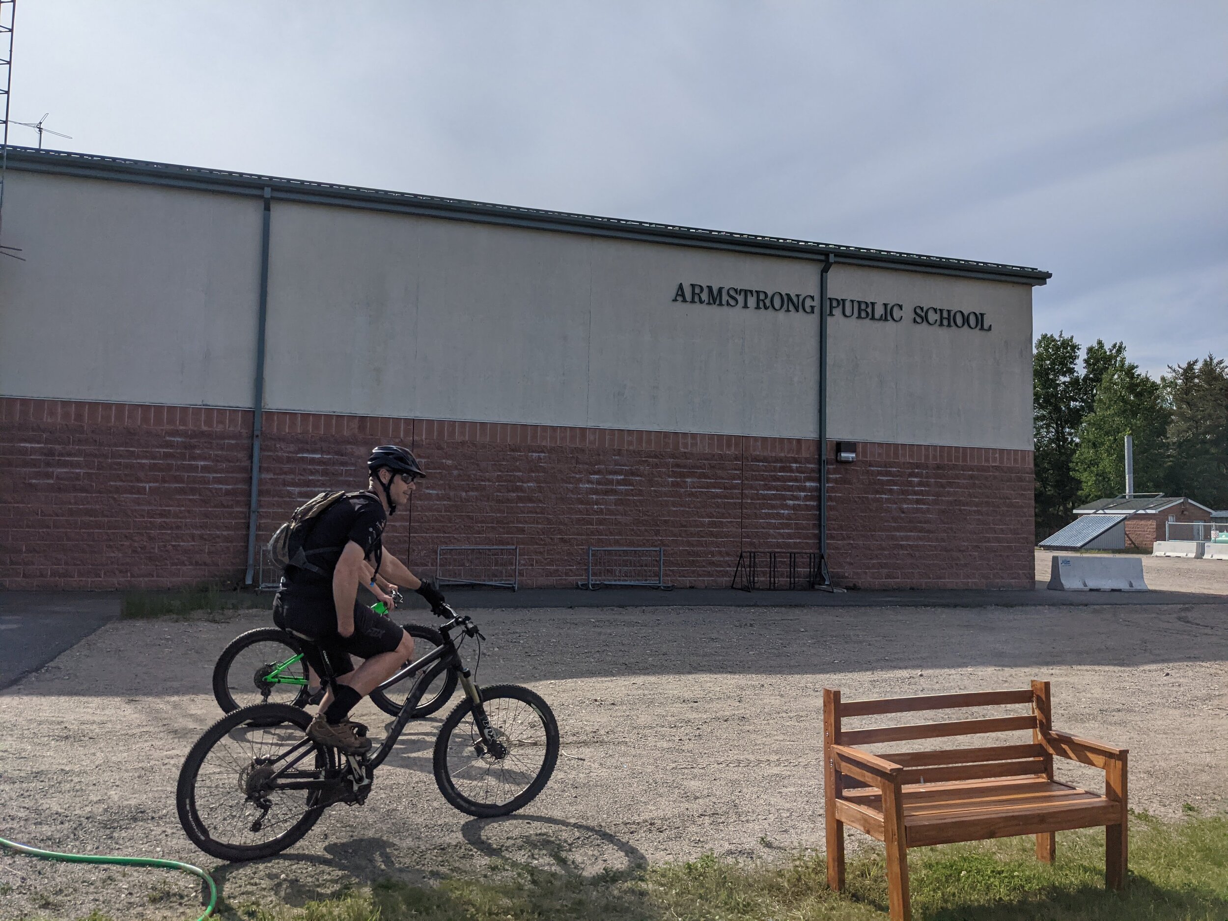 Riding past Armstrong Public School