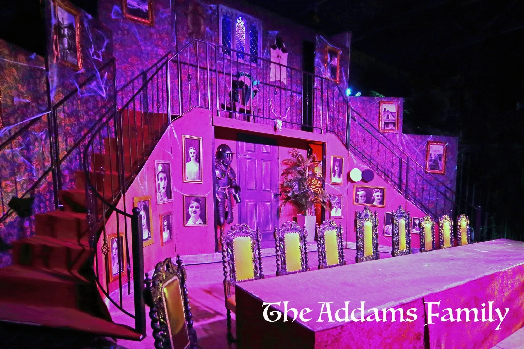 Addams Family - set hire - uk set and prop hire - packages - torture contraction - gates - great hall - staircases- torture chair - exterior - gravestones - tables