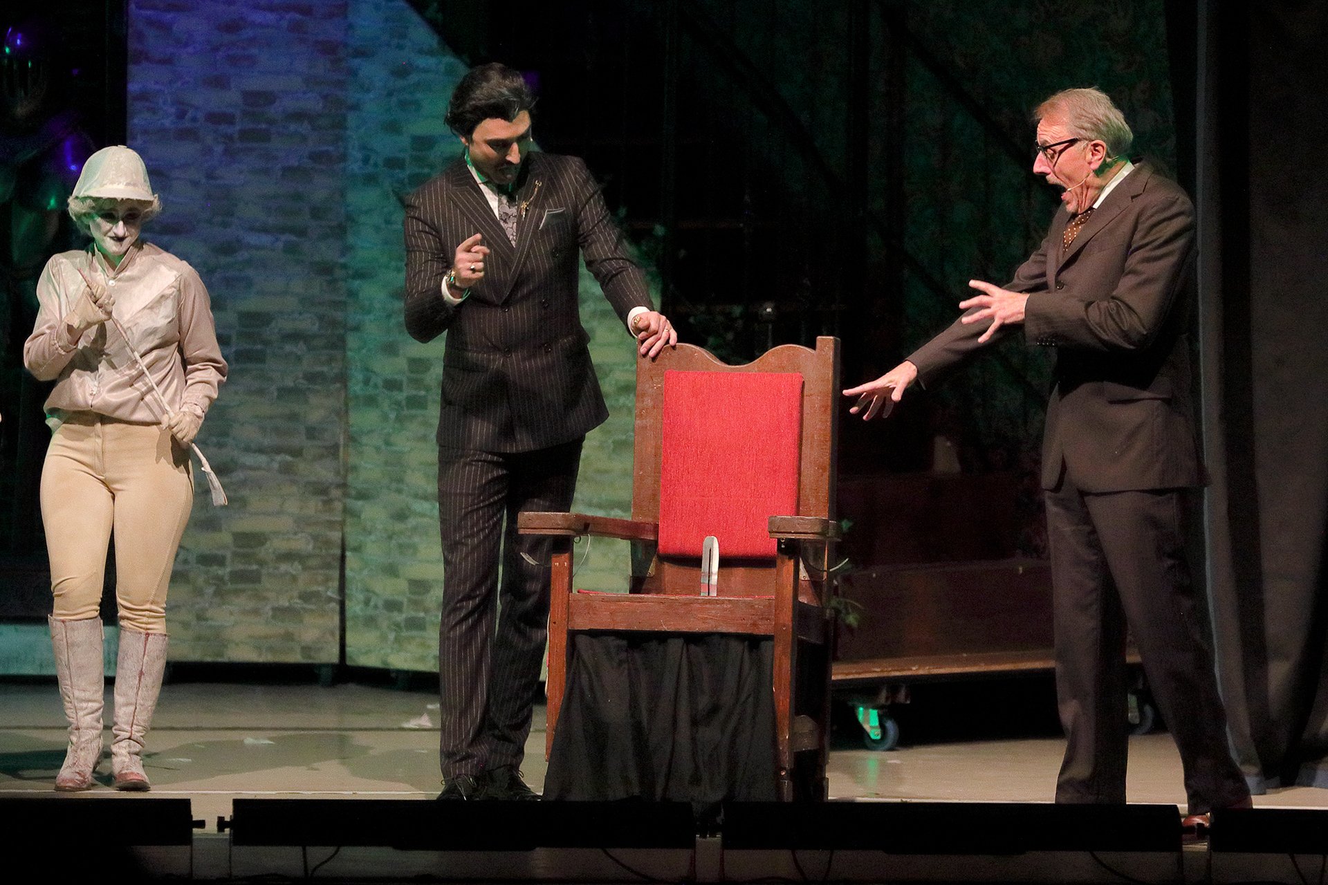 Addams Family - set hire - uk set and prop hire - packages - torture contraction - gates - great hall - staircases- torture chair - exterior - gravestones - tables