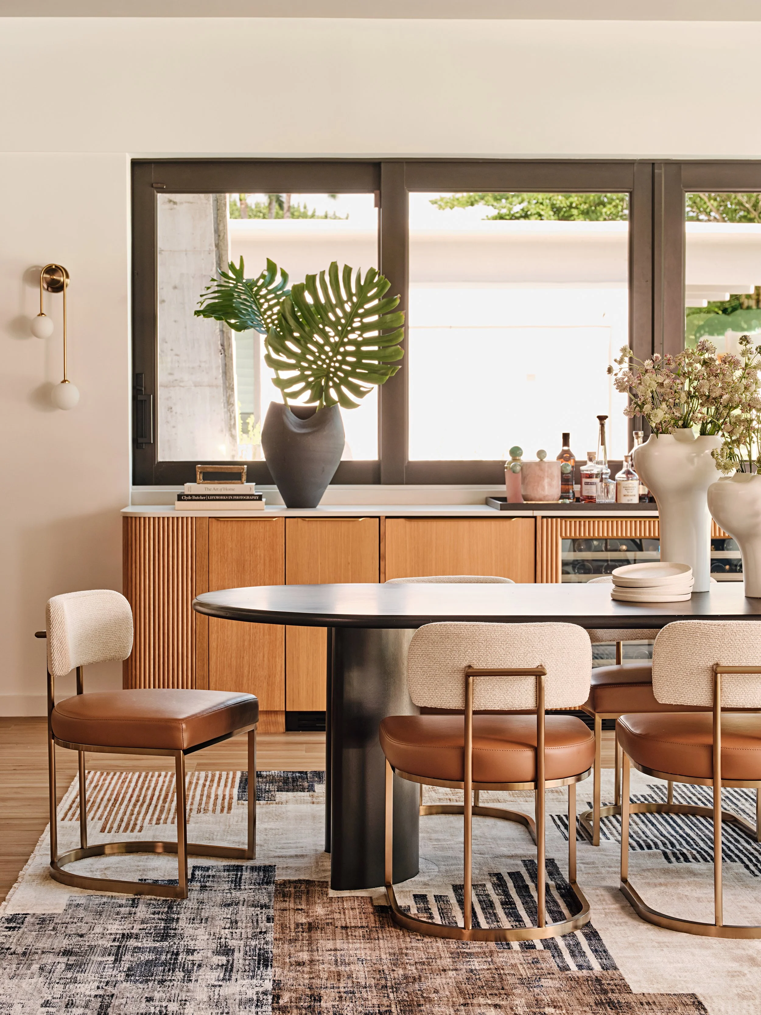 Dining room with built in custom bar cabinetry in Miami, Fl home. Interior design by Concept 2 Design