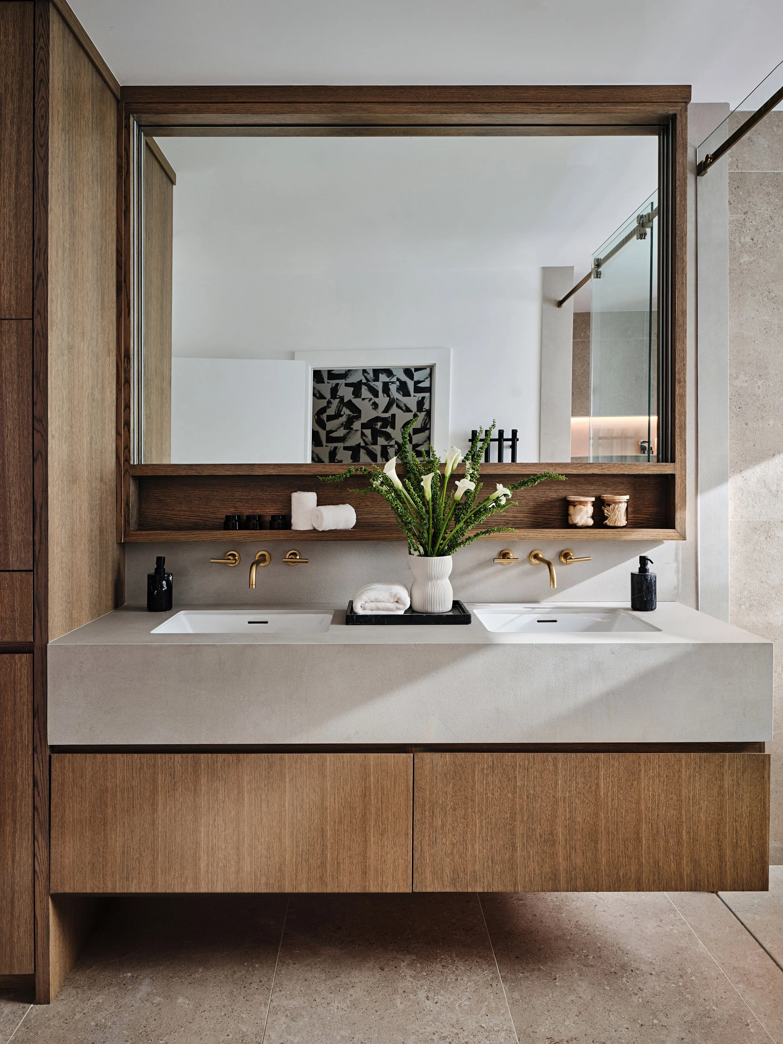 Contemporary double sink wall hung custom bathroom vanity cabinet. Rift cut oak wood cabinetry. Interior design by Concept 2 Design.