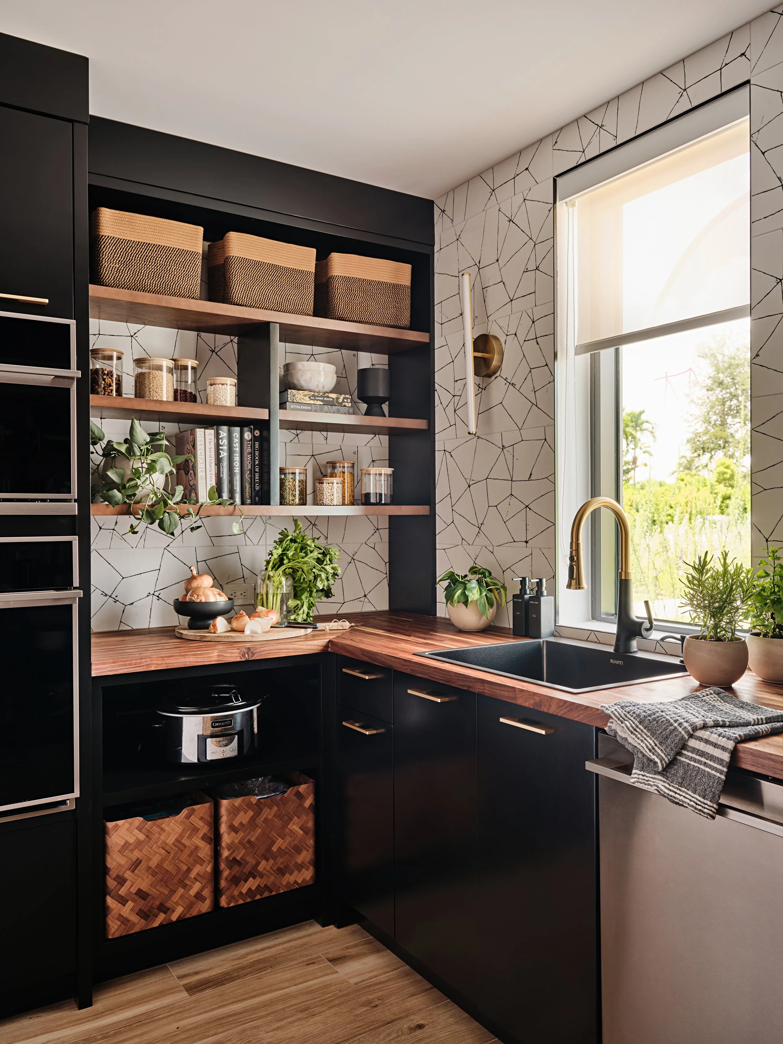 Butlers pantry with custom cabinetry and butcher block countertops. New construction home in South Florida. Interior design by Concept 2 Design.