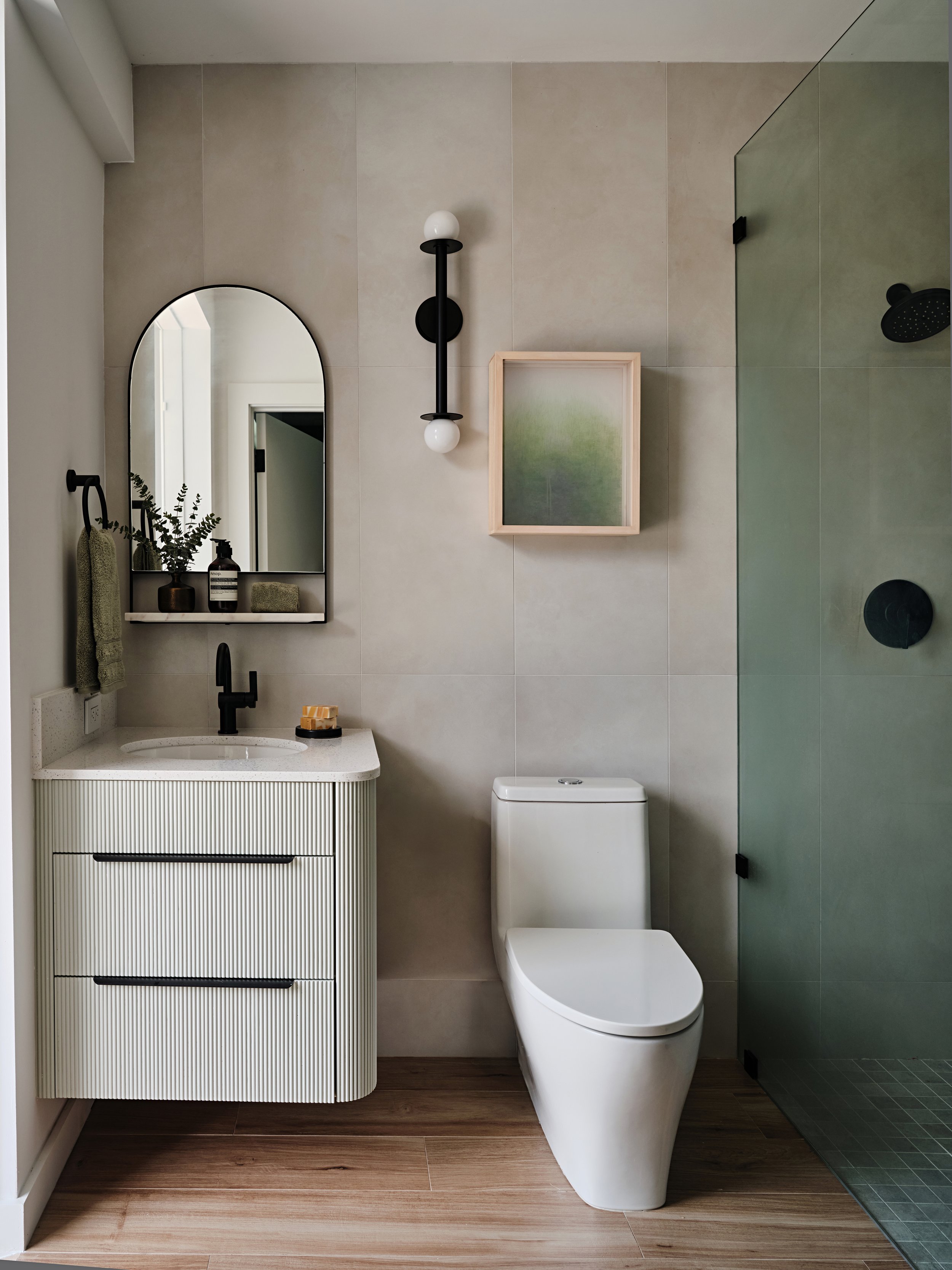 Cabana bathroom with fluted curved custom cabinetry. New construction residence in Miami, Fl. Interior design by Concept 2 Design.
