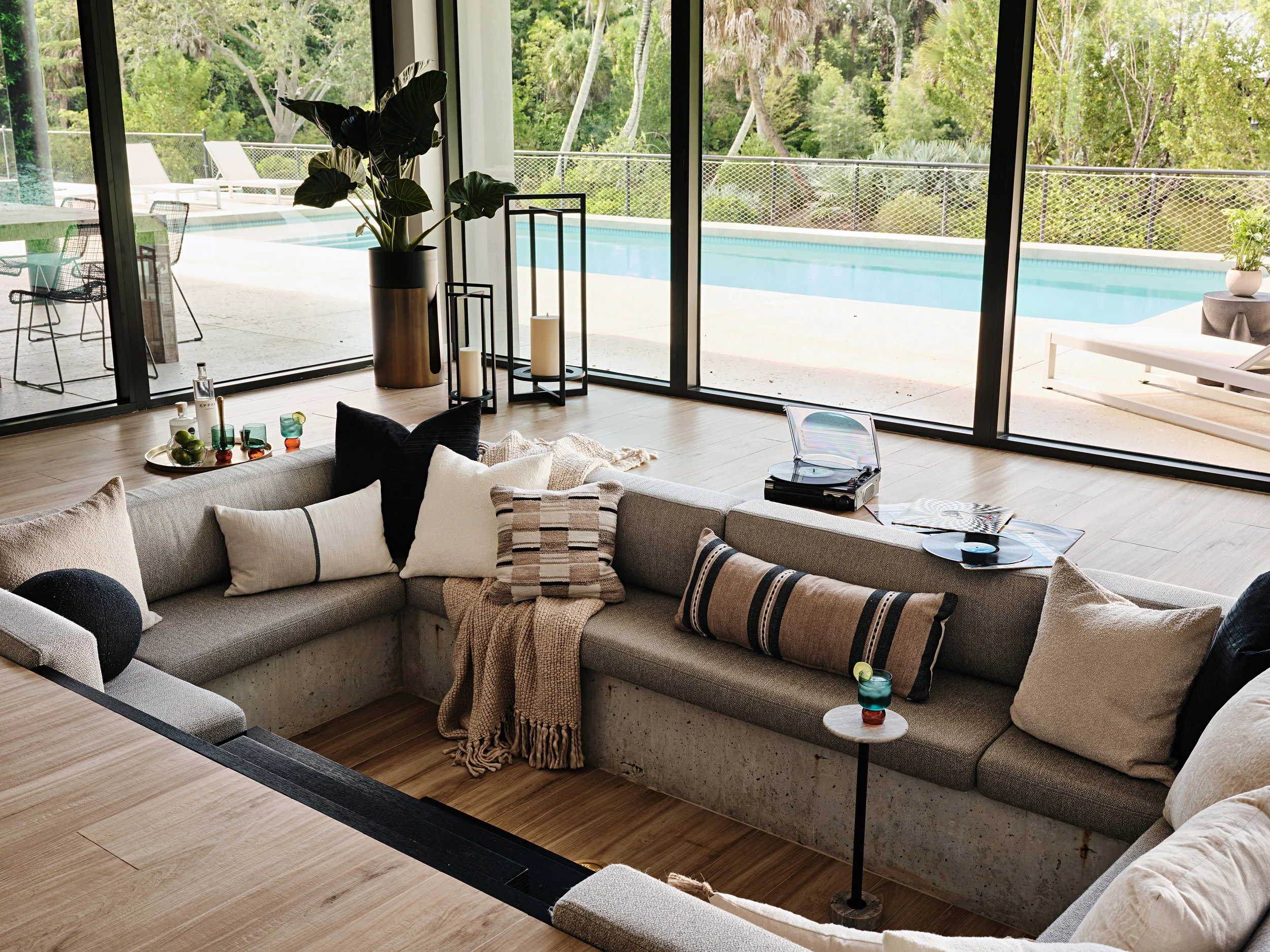Sunken living room for a new construction home in South Florida. Interior design by Concept 2 Design.