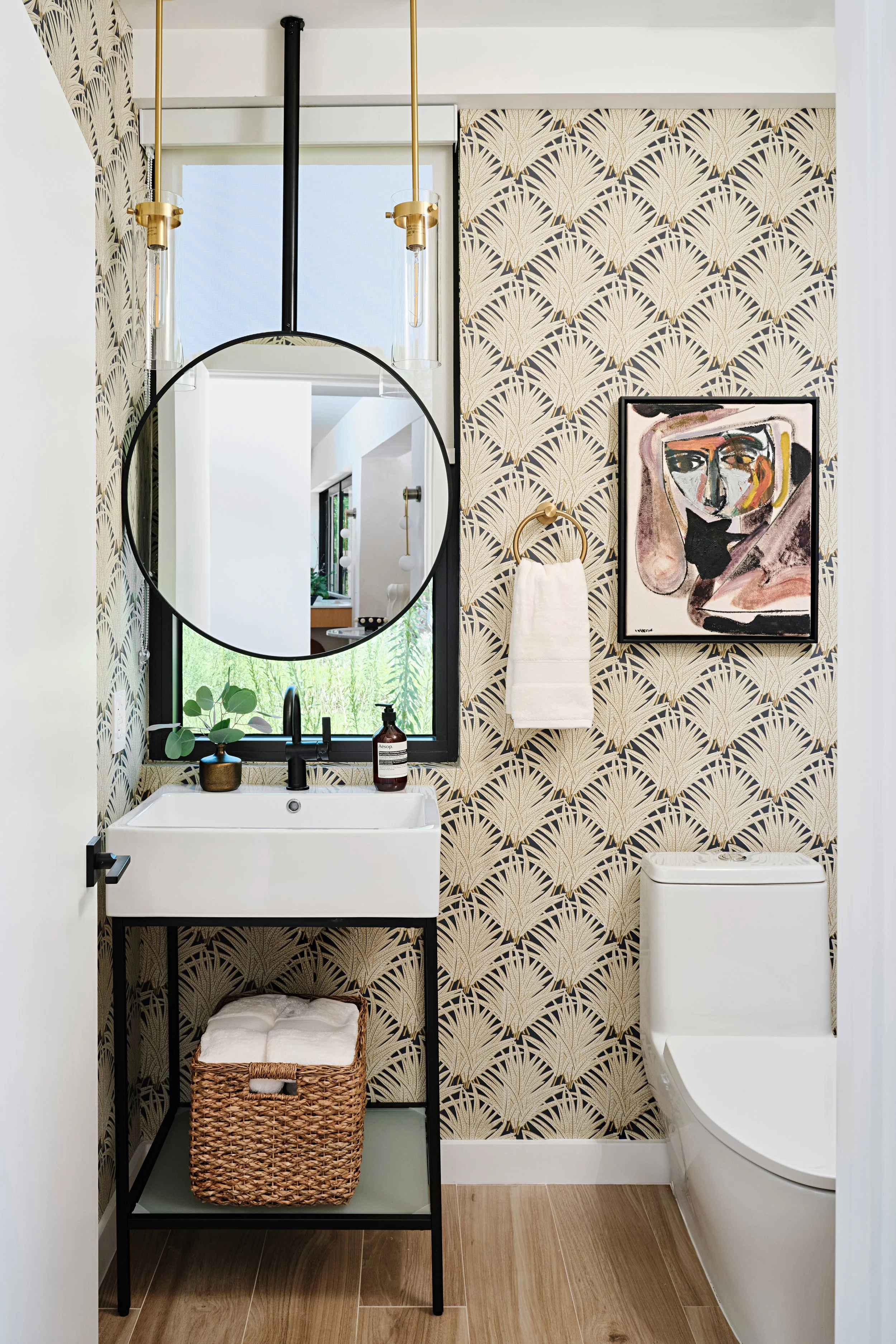 Wallpapered powder room for a home in Miami, Fl. Interior design by Concept 2 Design