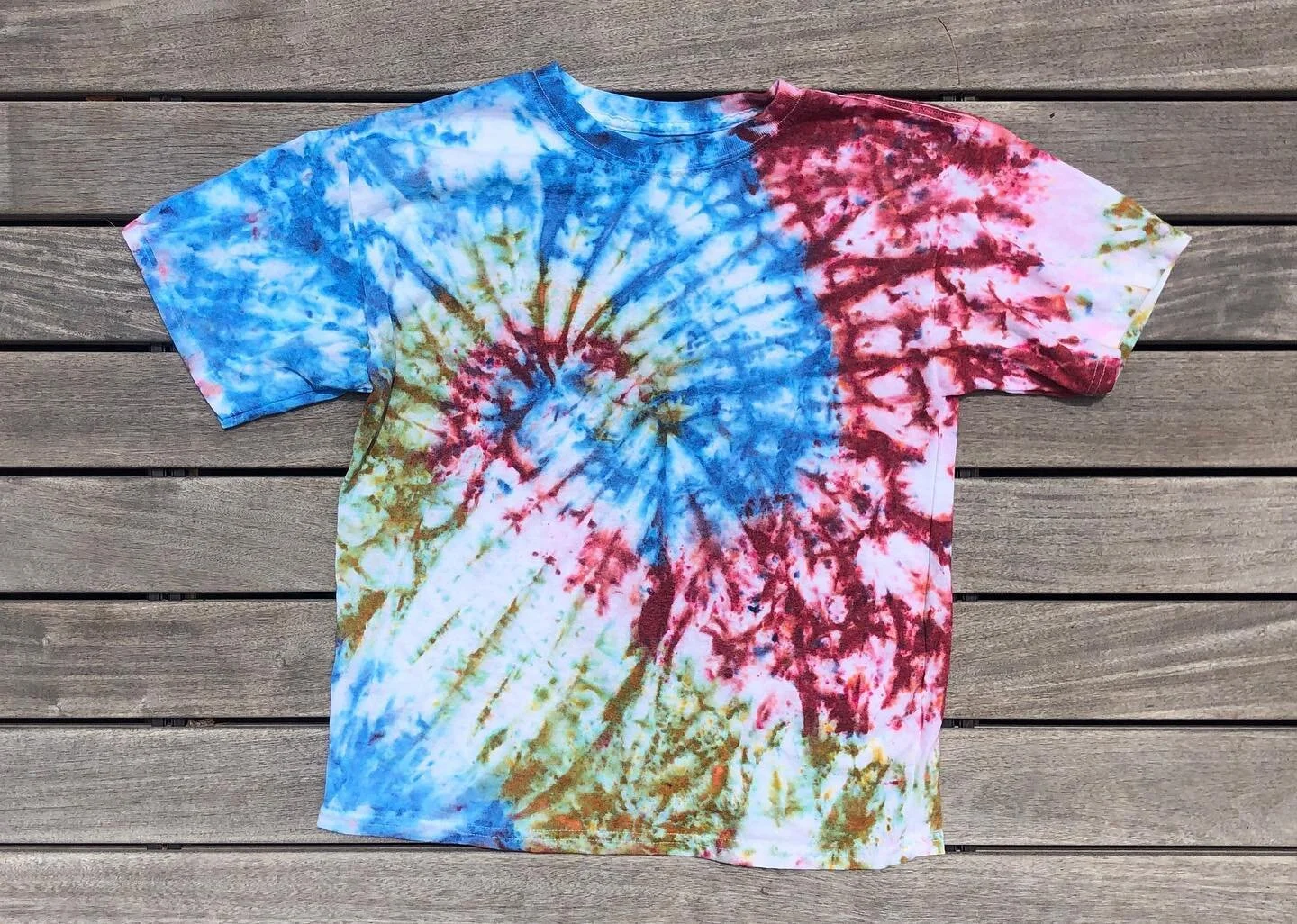 Hanes EcoSmart kids t-shirt. Powdered dye on wet swirl fabric (LOOKS FUCKING COOL) in peacock blue, wasabi green and burgundy. Size youth-XL (fits like an adult XS/S). $40. $20 goes to @astoria_mutual_aid. #tiedye #tiedyeshirt #tiedyefashion #tiedyel