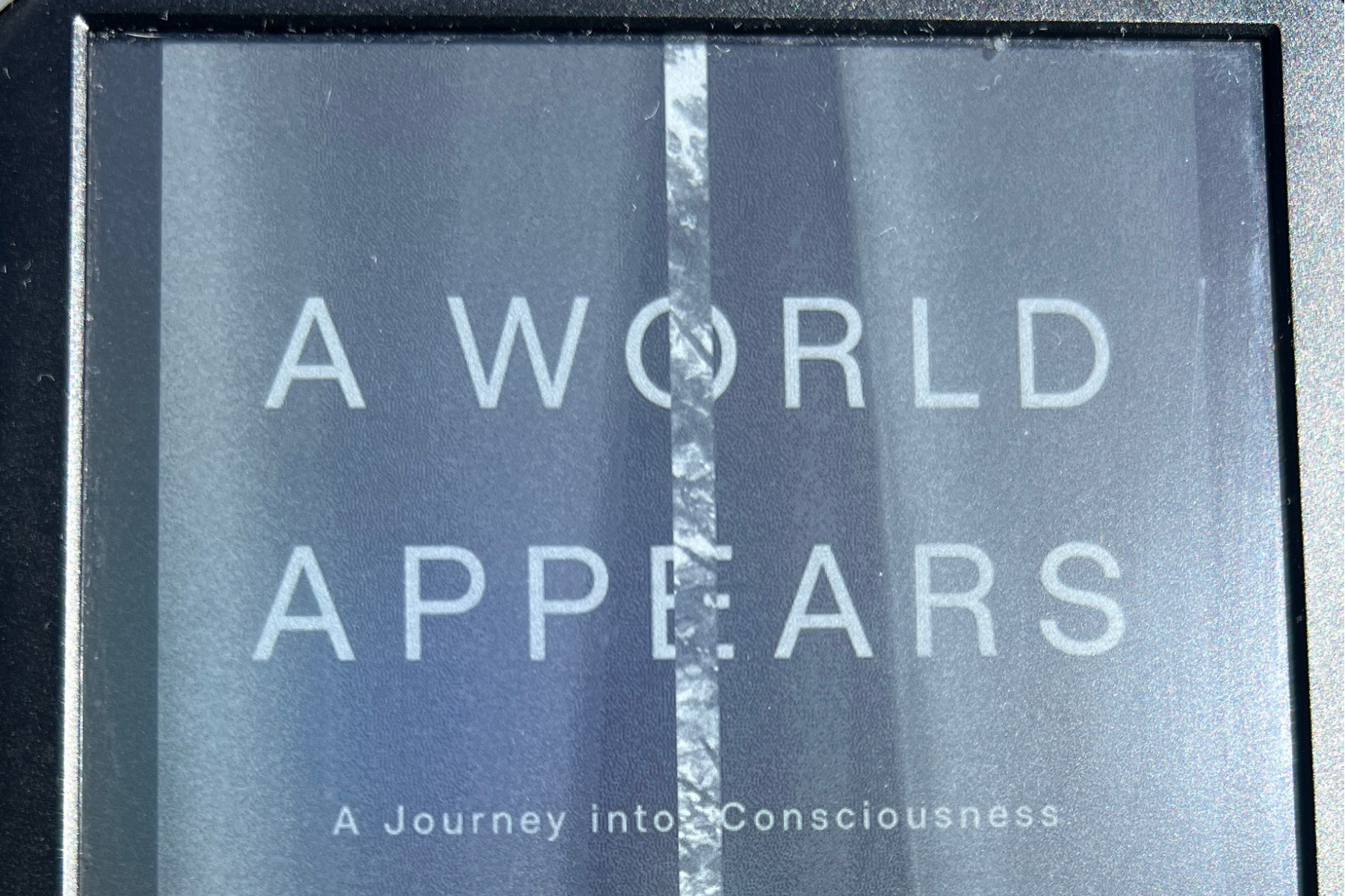 Book cover of A World Appears: A Journey into Consciousness by Michael Pollan on an e-reader screen