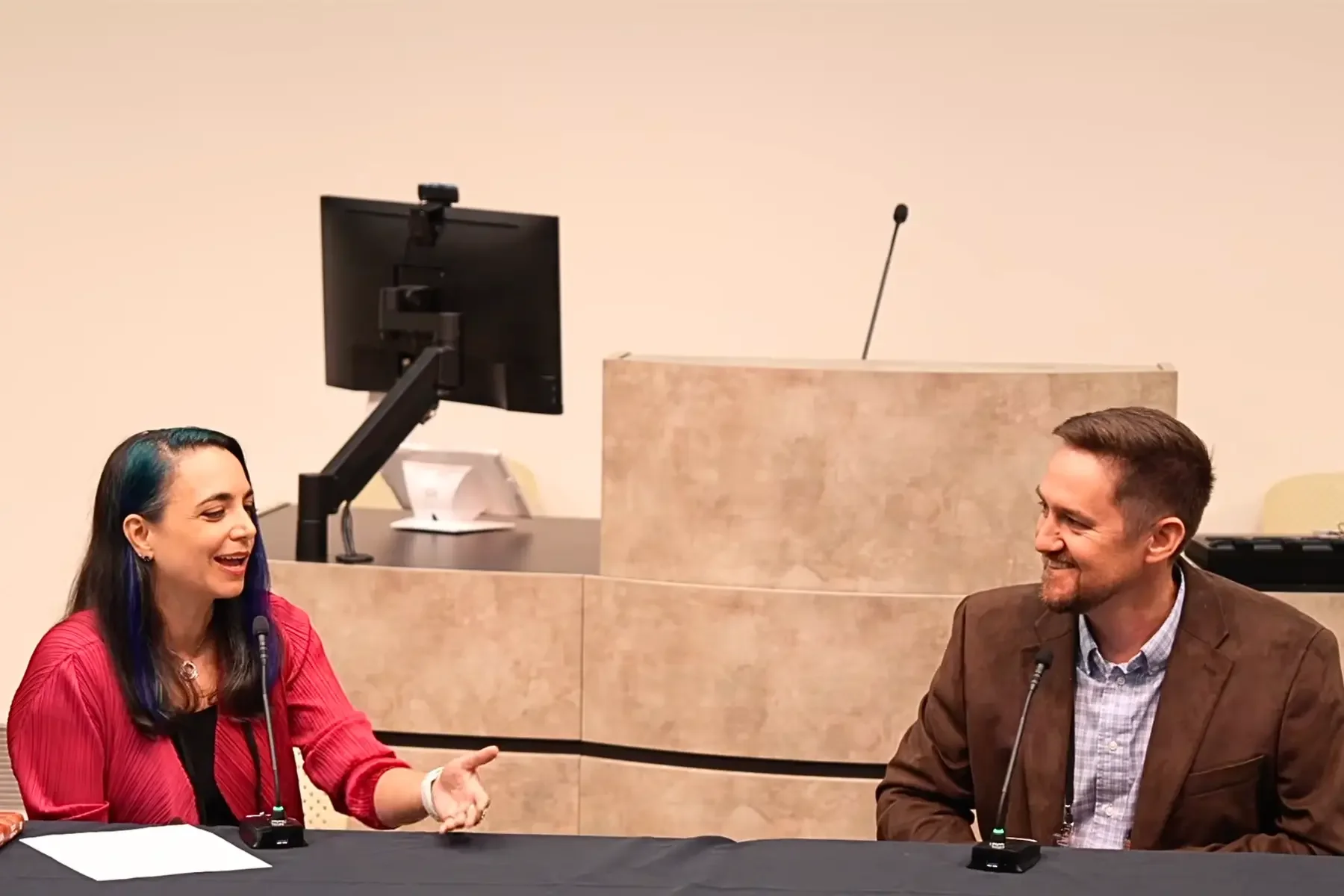 Dr. Tiffany Vora and Dr. Scott Solomon engaged in a conversation on stage during a live interview session at the Humans to the Moon and Mars Summit in Houston.