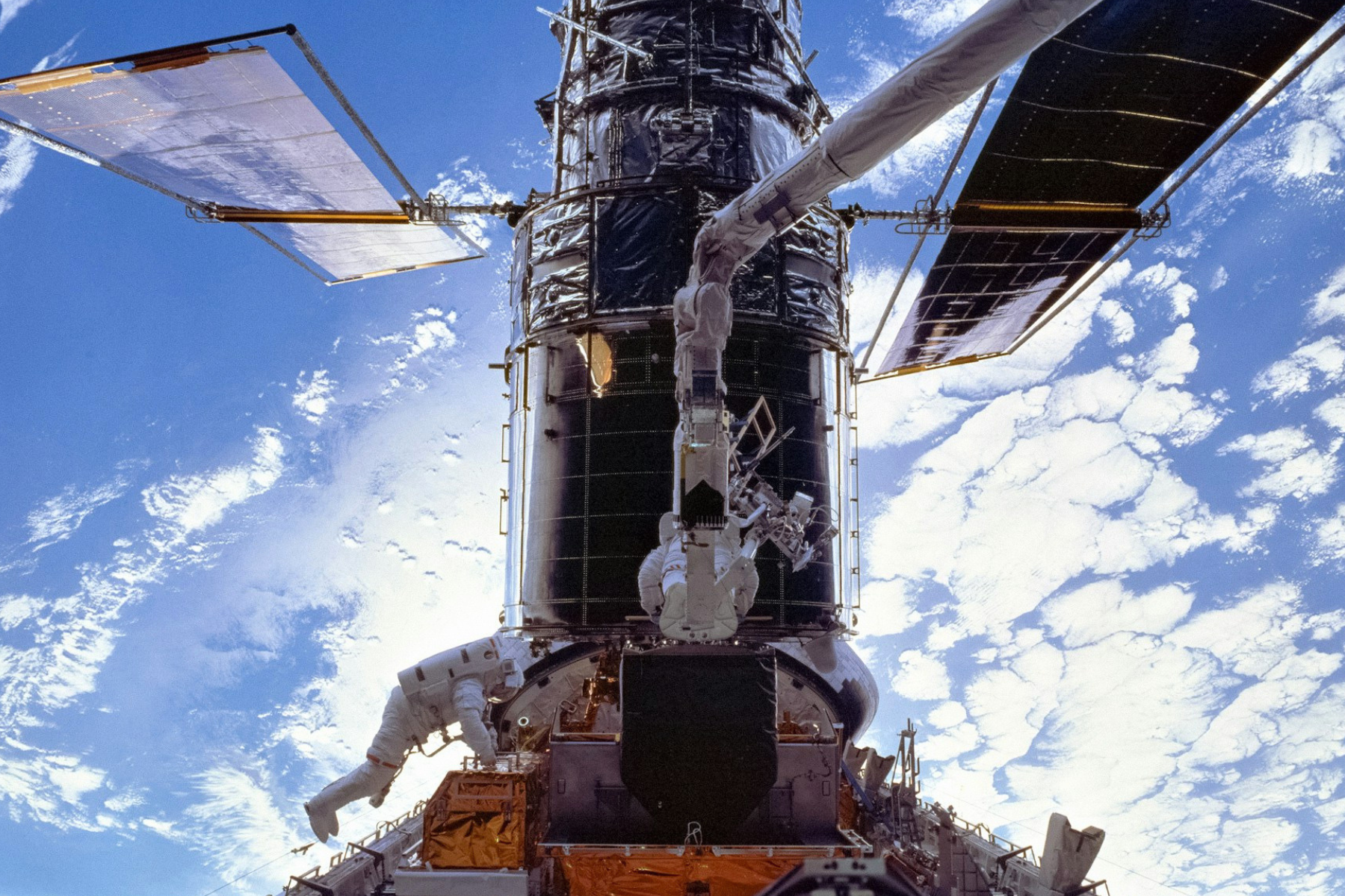 NASA Hubble Space Telescope in orbit representing the messy and emotional reality of scientific discovery.