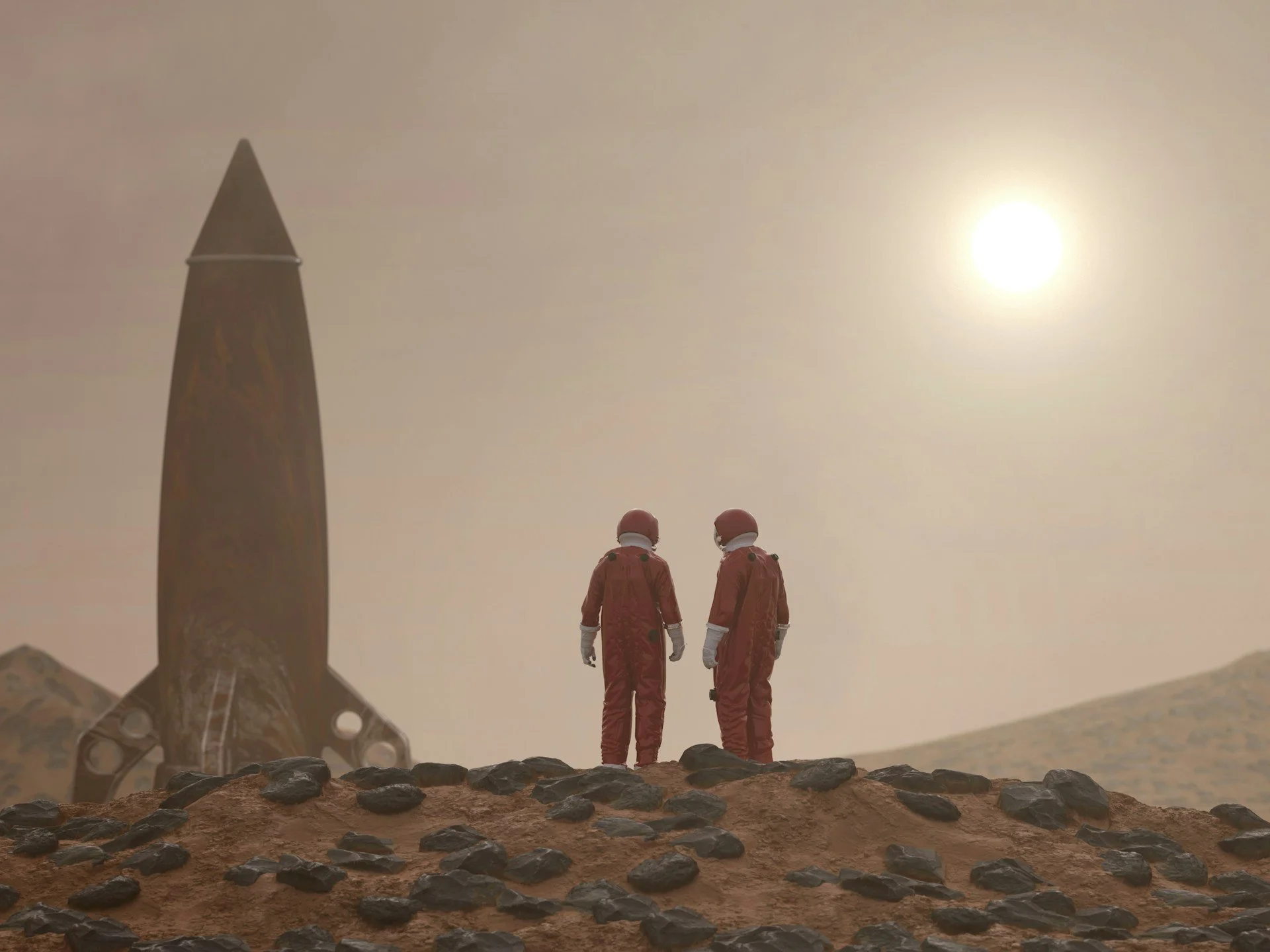 Two astronauts in red pressure suits stand on a rocky, rust-coloured Martian ridge, looking toward a silver rocket ship grounded in the distance under a hazy sky.